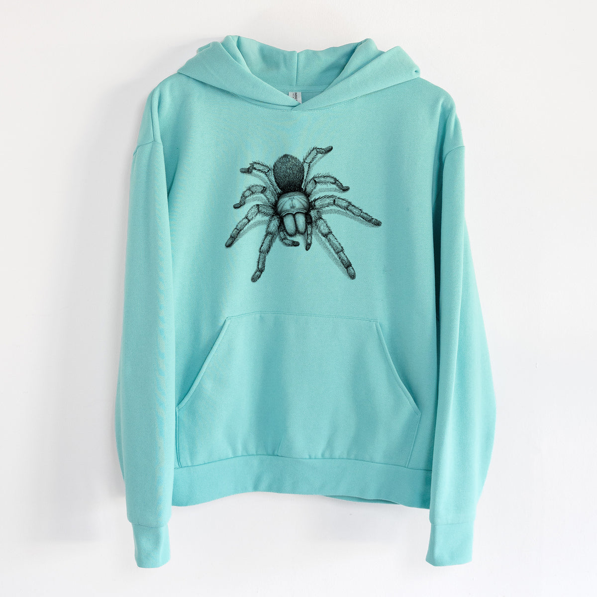 Desert Blonde Tarantula - Aphonopelma chalcodes - Statement Midweight Hoodie in Seafoam, hanging on a white wall, with a front kangaroo pocket and no drawcords.