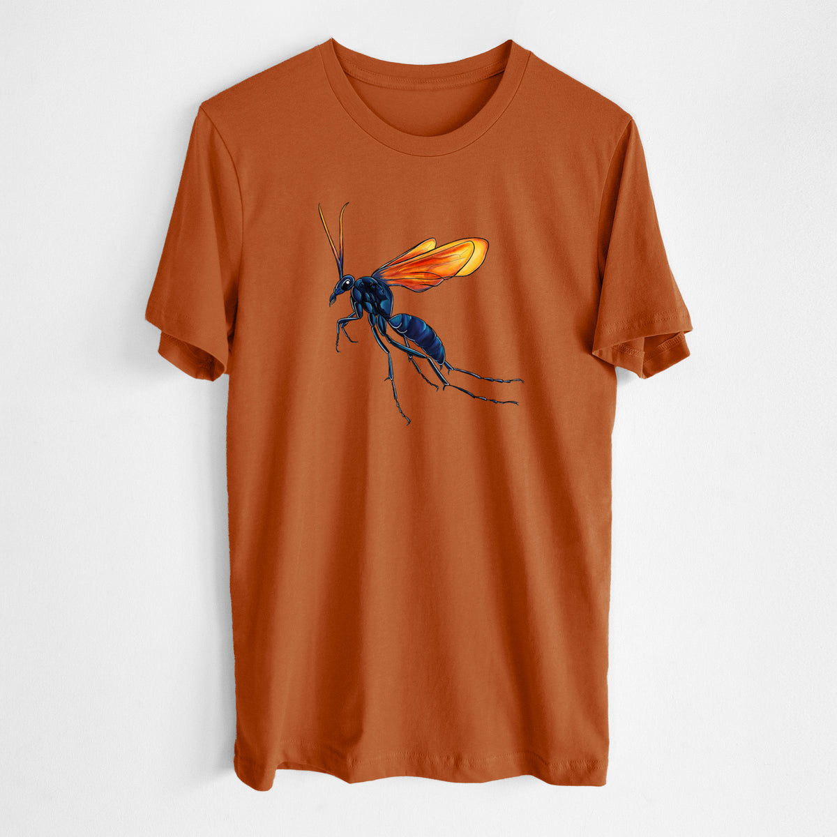 Autumn lightweight cotton t-shirt laid flat, printed with a full-color illustration of a tarantula hawk wasp with a blue body and orange wings.