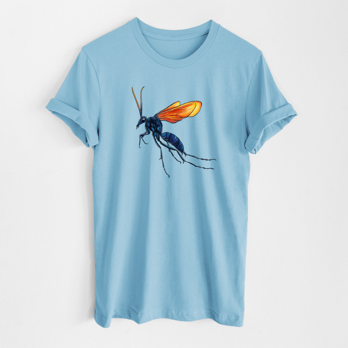 Ocean blue lightweight cotton t-shirt laid flat, printed with a full-color illustration of a tarantula hawk wasp with a blue body and orange wings.