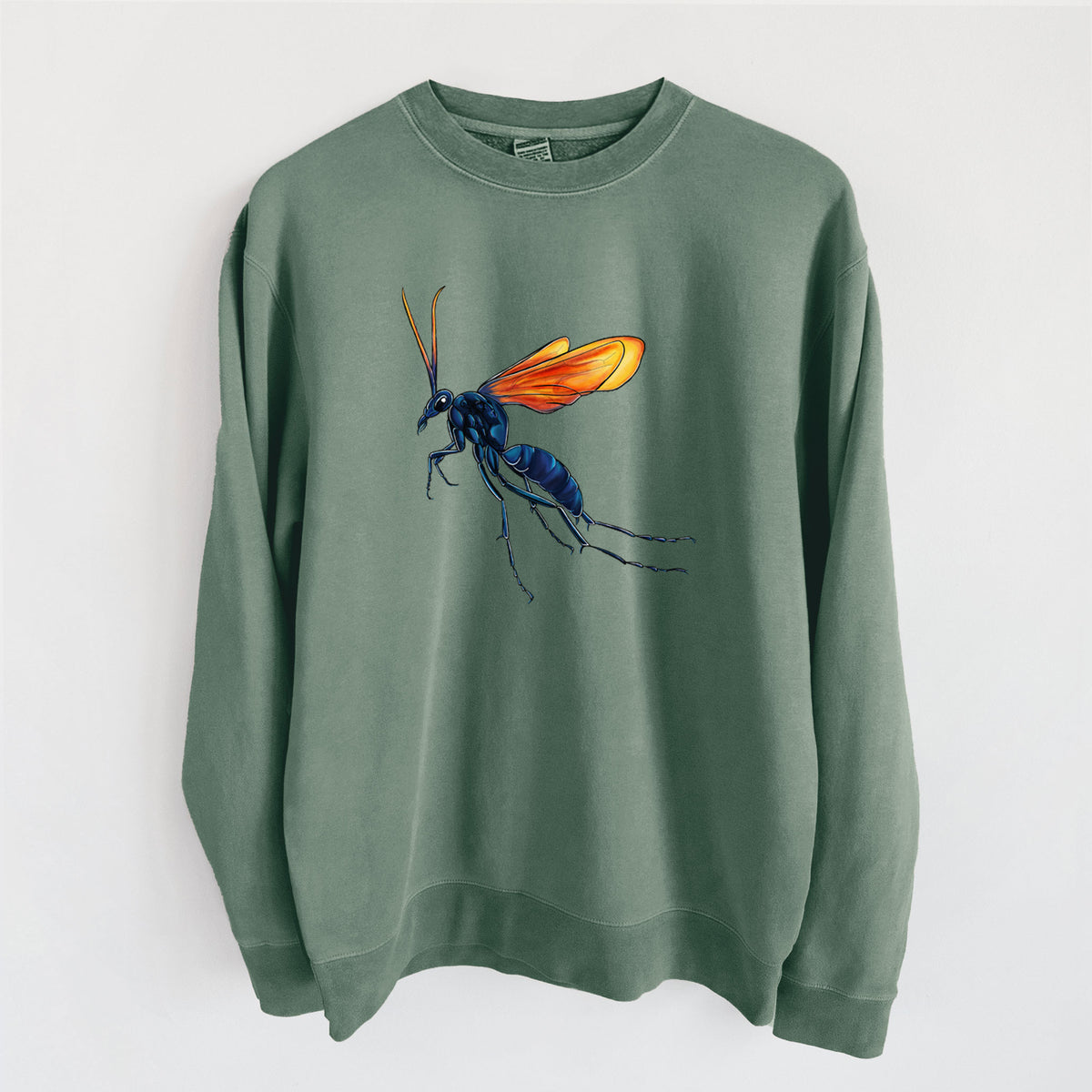 Alpine green pigment dyed crewneck sweatshirt laid flat, printed with a full-color illustration of a tarantula hawk wasp with a blue body and orange wings.