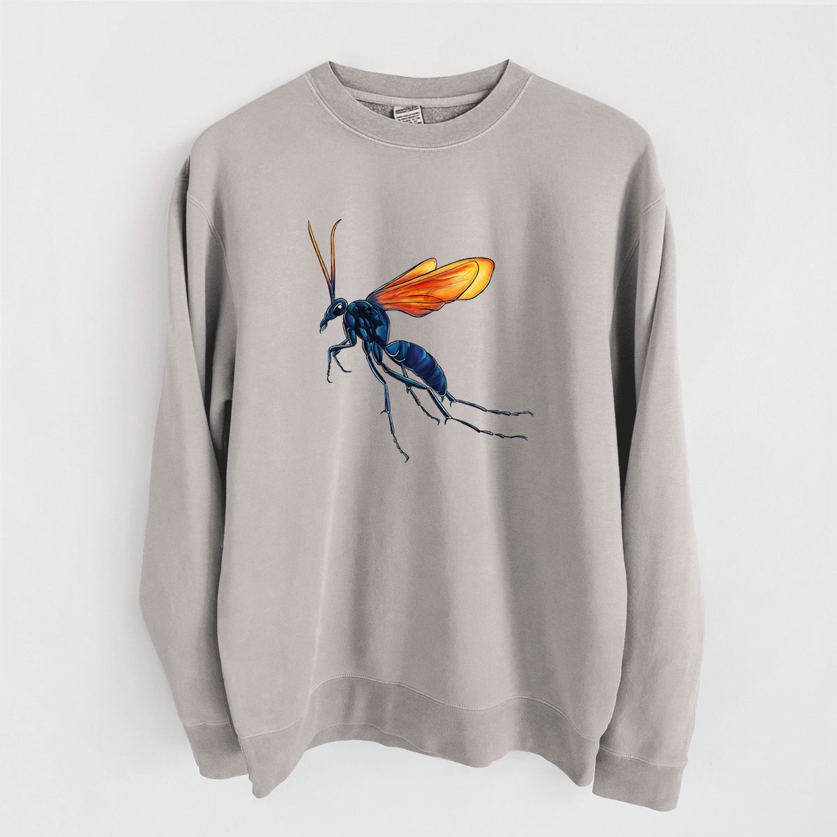 Cement grey pigment dyed crewneck sweatshirt laid flat, printed with a full-color illustration of a tarantula hawk wasp with a blue body and orange wings.