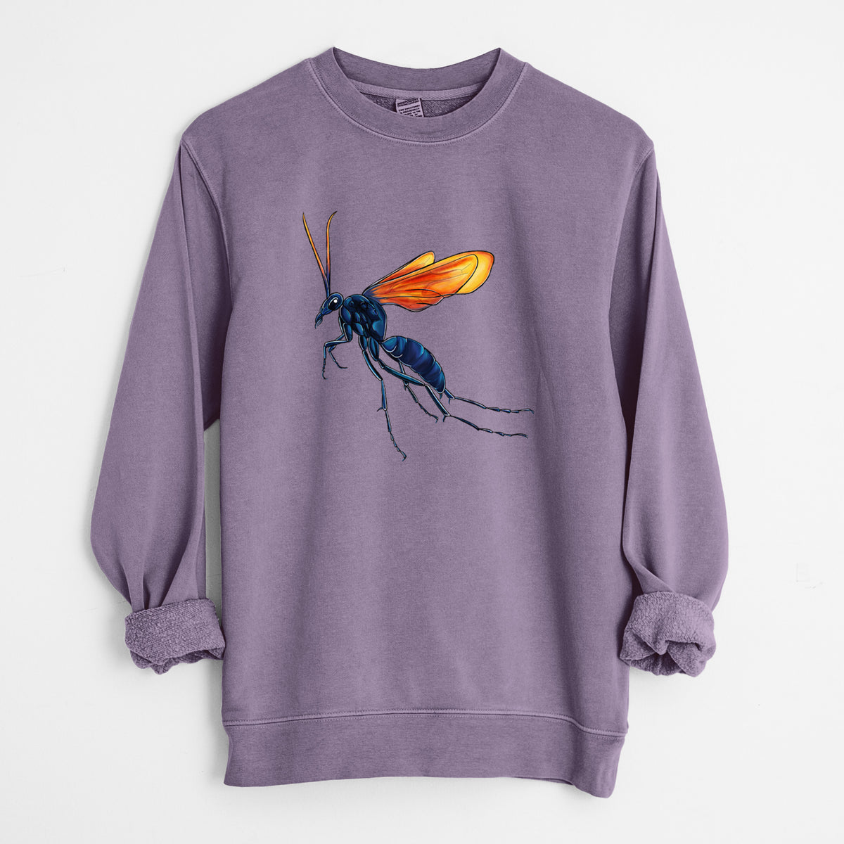 Plum purple pigment dyed crewneck sweatshirt laid flat with the sleeves rolled, printed with a full-color illustration of a tarantula hawk wasp with a blue body and orange wings.