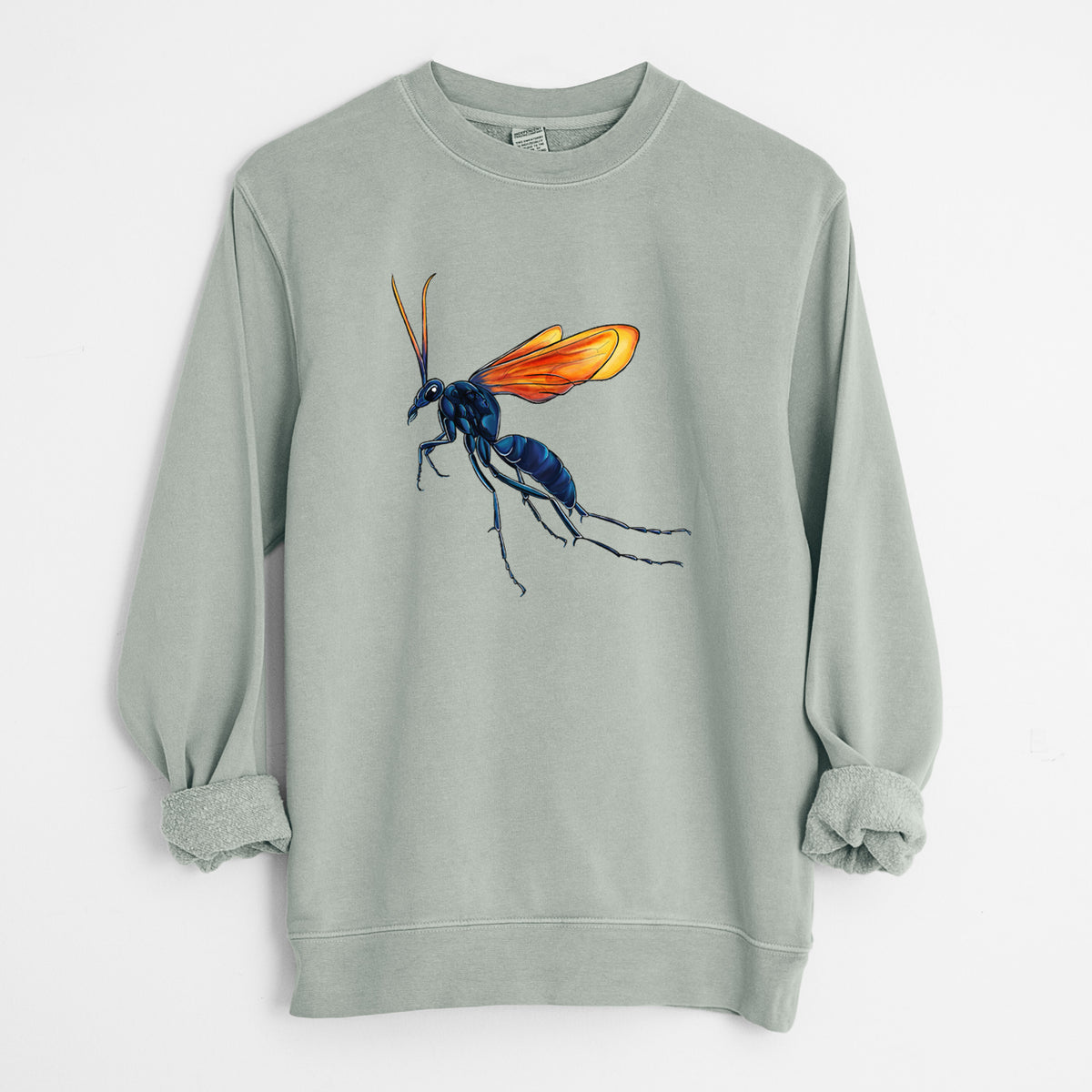 Sage green pigment dyed crewneck sweatshirt laid flat with the sleeves rolled, printed with a full-color illustration of a tarantula hawk wasp with a blue body and orange wings.