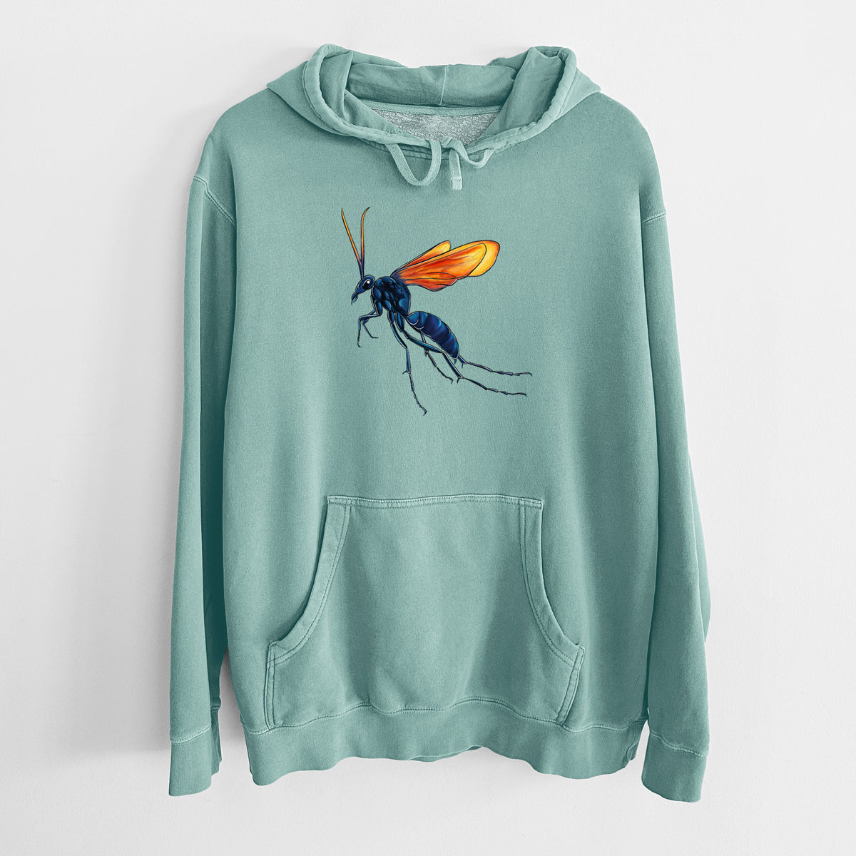 Mint green pigment dyed hoodie laid flat, printed with a full-color illustration of a tarantula hawk wasp with a blue body and orange wings.