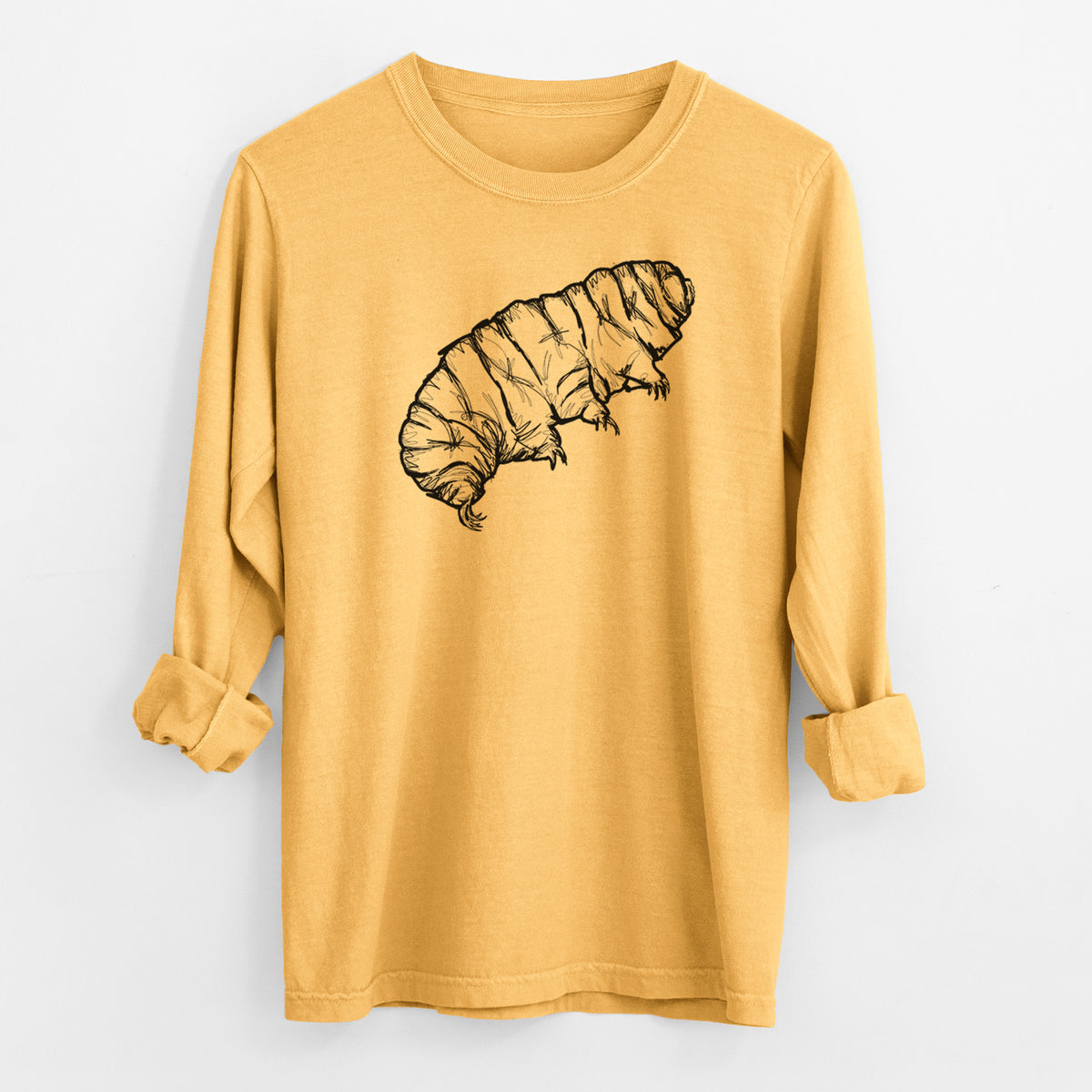 Golden wheat yellow Comfort Colors long sleeve shirt laid flat with the cuffs rolled, printed with a detailed black ink illustration of a tardigrade, or water bear.