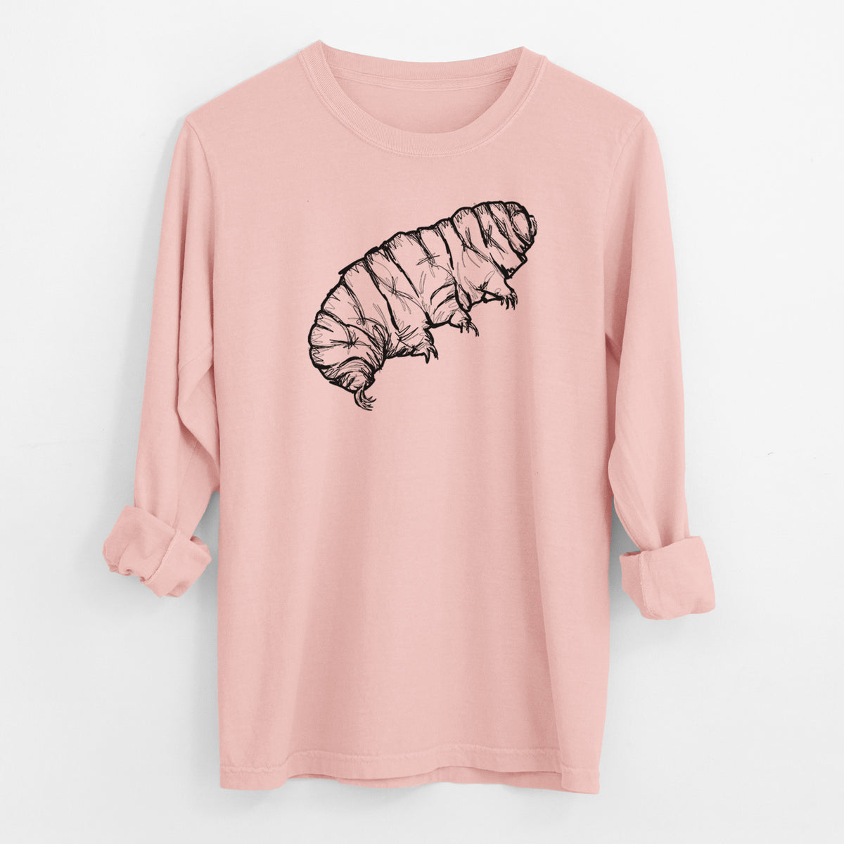 Peachy Comfort Colors long sleeve shirt laid flat with the cuffs rolled, printed with a detailed black ink illustration of a tardigrade, or water bear.