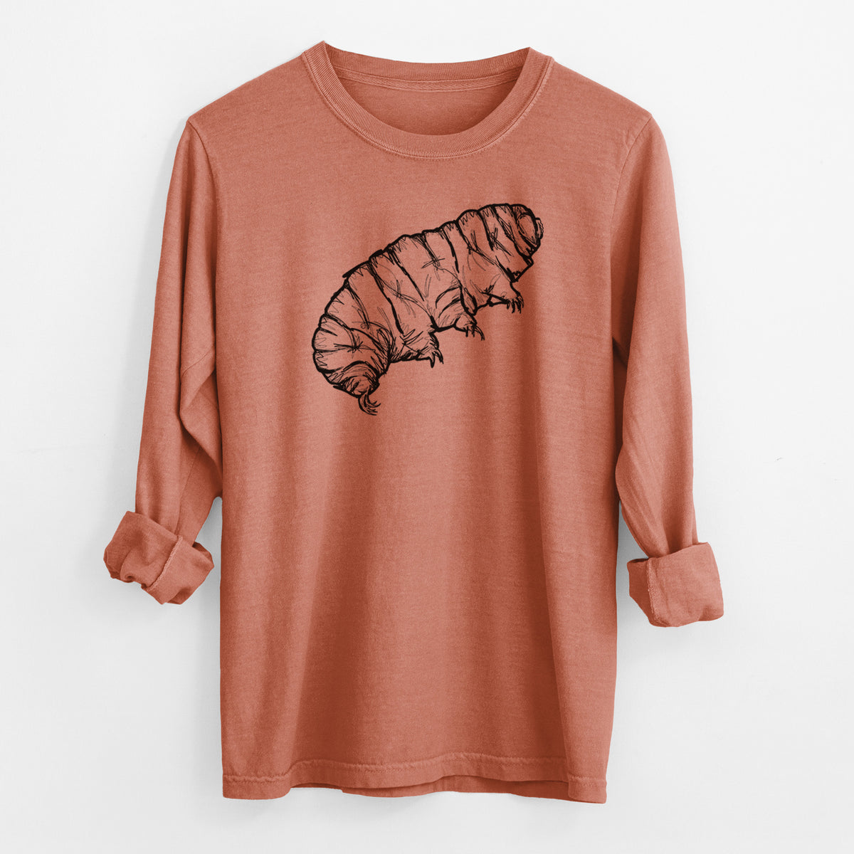 Yam burnt orange Comfort Colors long sleeve shirt laid flat with the cuffs rolled, printed with a detailed black ink illustration of a tardigrade, or water bear.