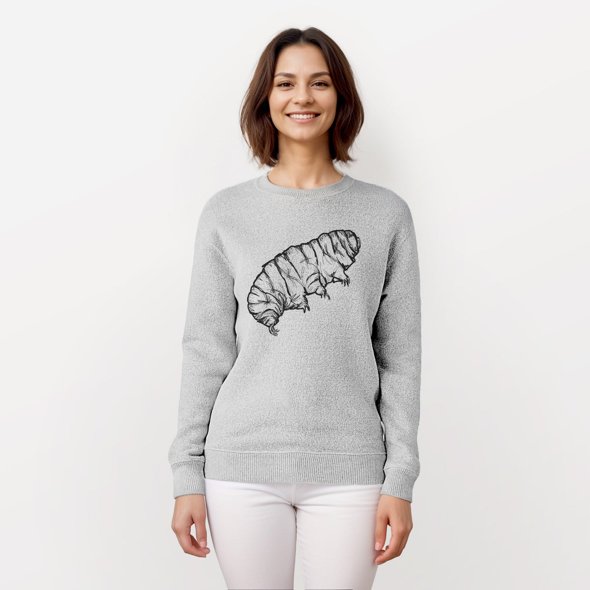 Woman wearing a knit sweatshirt printed with a detailed black ink illustration of a tardigrade, or water bear.