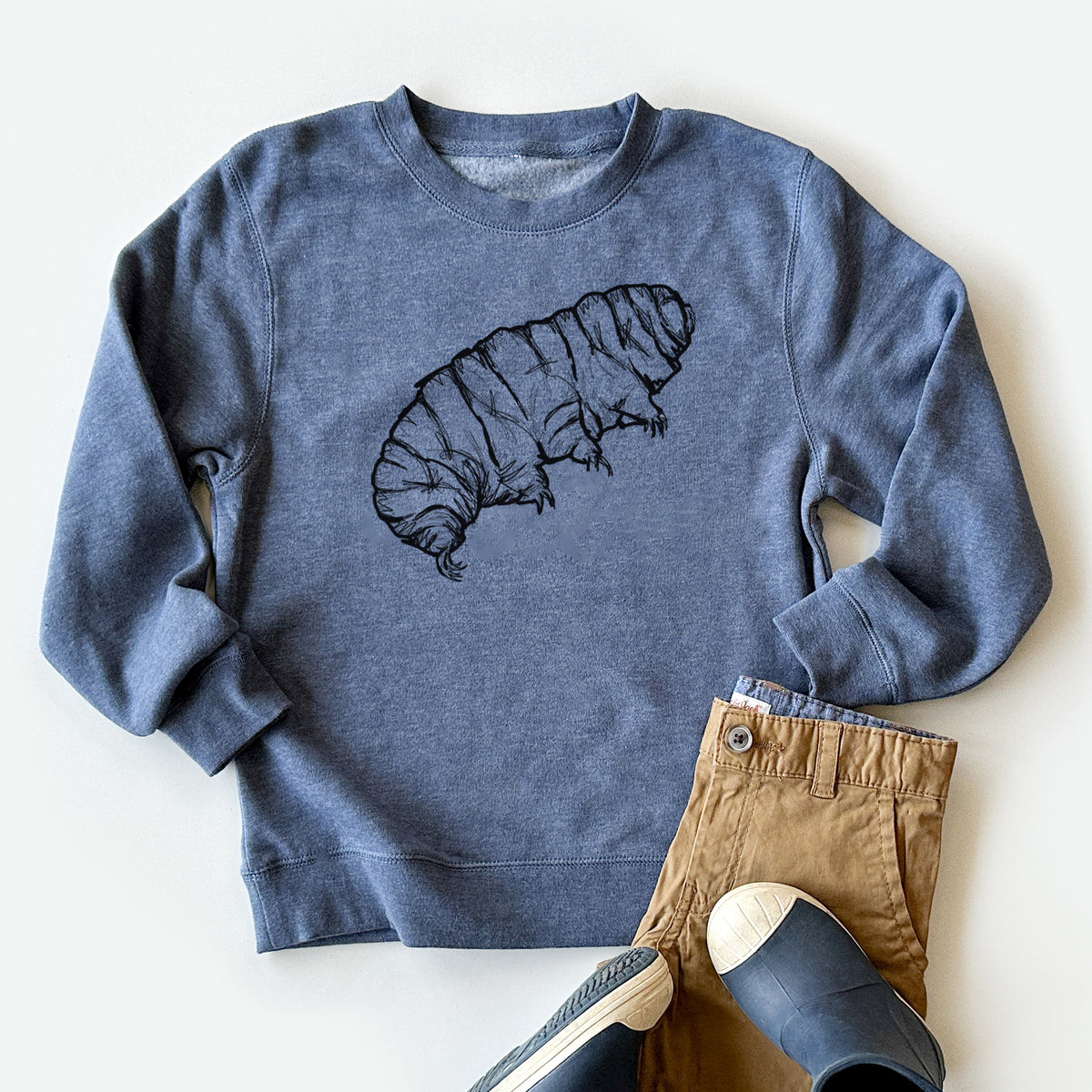 Youth crewneck sweatshirt printed with a detailed black ink illustration of a tardigrade, or water bear, styled flat with khaki pants and shoes.
