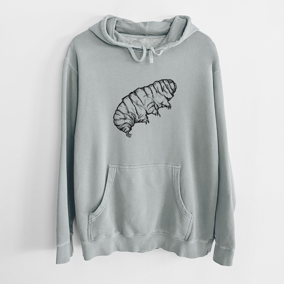 Sage green pigment dyed hoodie laid flat, printed with a detailed black ink illustration of a tardigrade, or water bear.