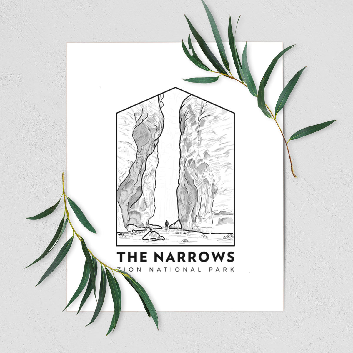 Art print of a black line art badge of the tall canyon walls of The Narrows, with the words The Narrows, shown with eucalyptus leaves.