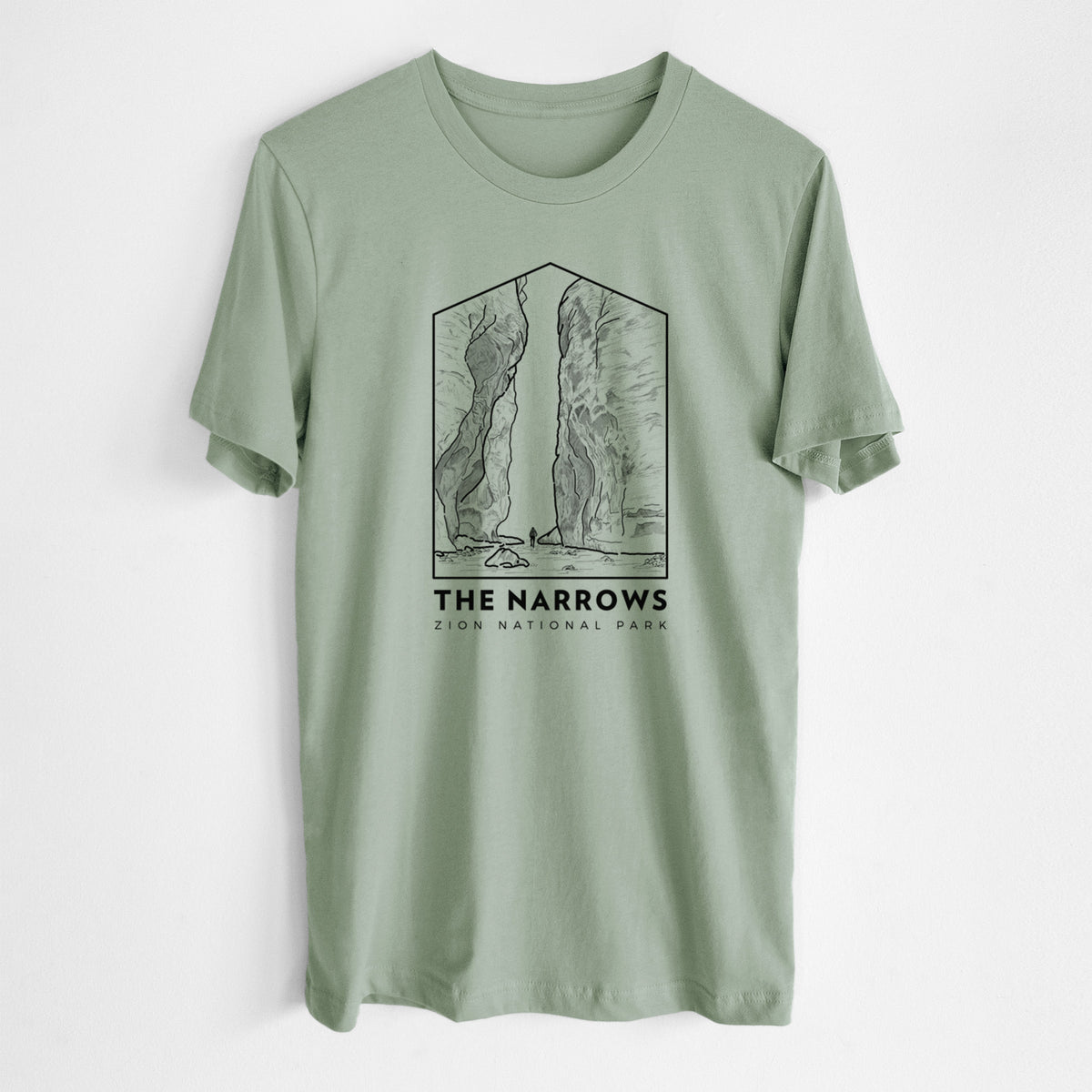 Sage green lightweight cotton t-shirt laid flat, printed with a black line art badge of the tall canyon walls of The Narrows, with the words The Narrows.