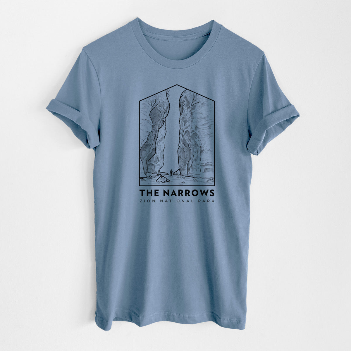 Steel blue lightweight cotton t-shirt laid flat, printed with a black line art badge of the tall canyon walls of The Narrows, with the words The Narrows.