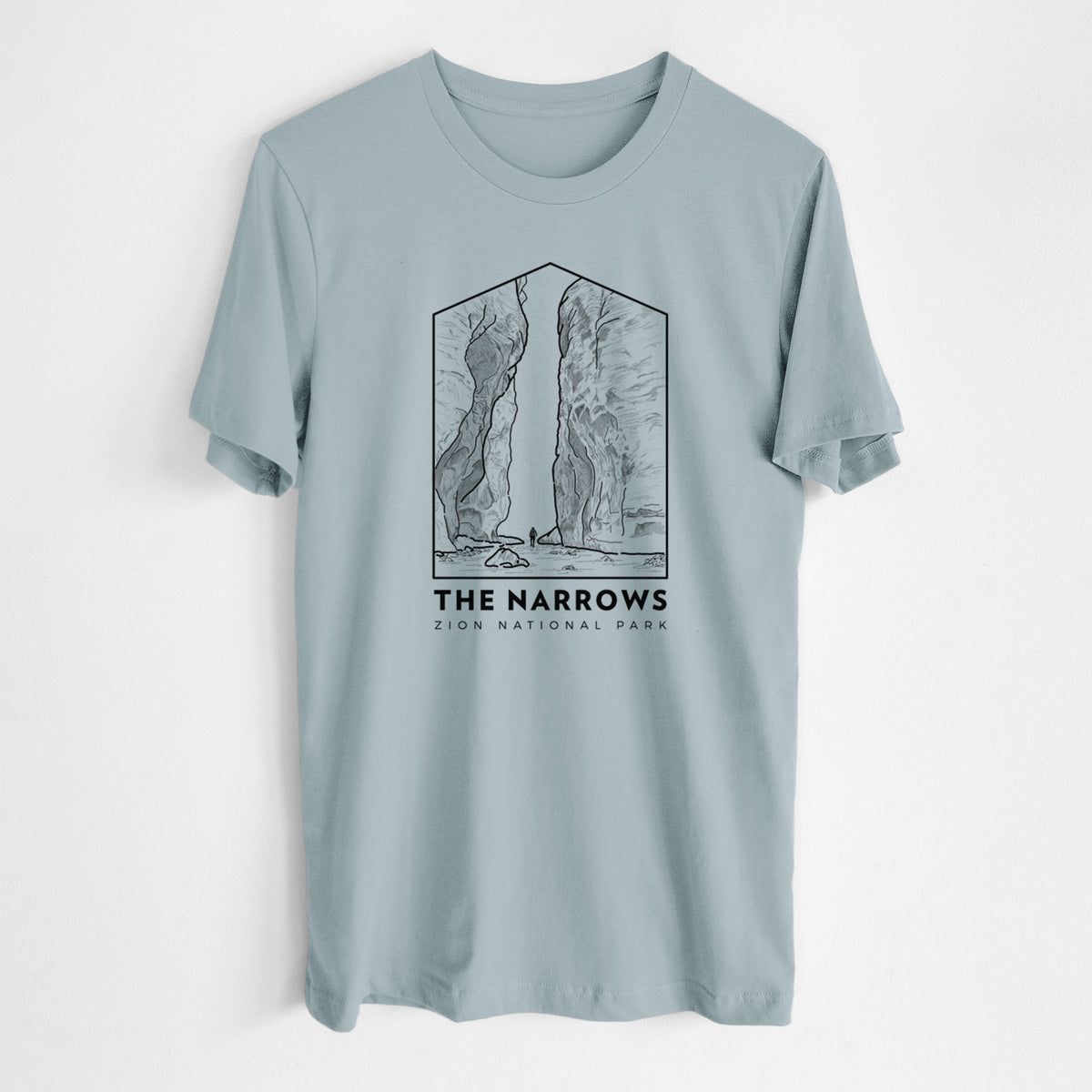 Vintage denim lightweight cotton t-shirt laid flat, printed with a black line art badge of the tall canyon walls of The Narrows, with the words The Narrows.
