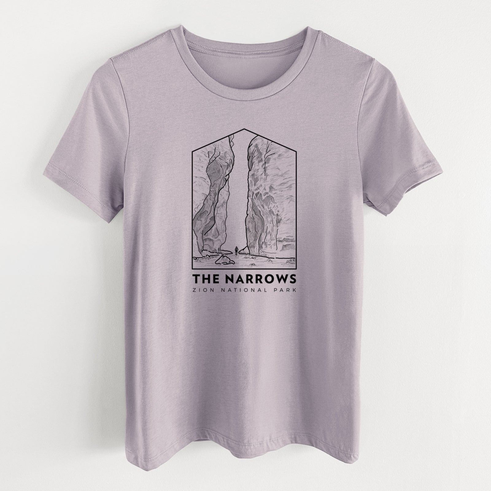 Light violet women's relaxed fit cotton t-shirt laid flat, printed with a black line art badge of the tall canyon walls of The Narrows, with the words The Narrows.