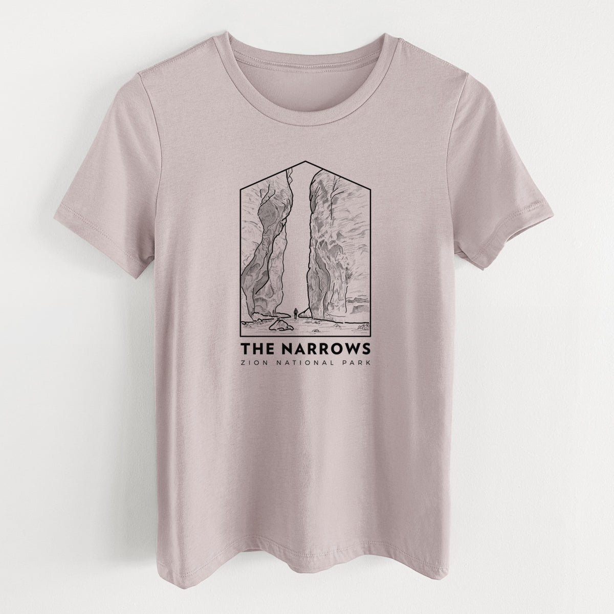 Pink gravel women's relaxed fit cotton t-shirt laid flat, printed with a black line art badge of the tall canyon walls of The Narrows, with the words The Narrows.