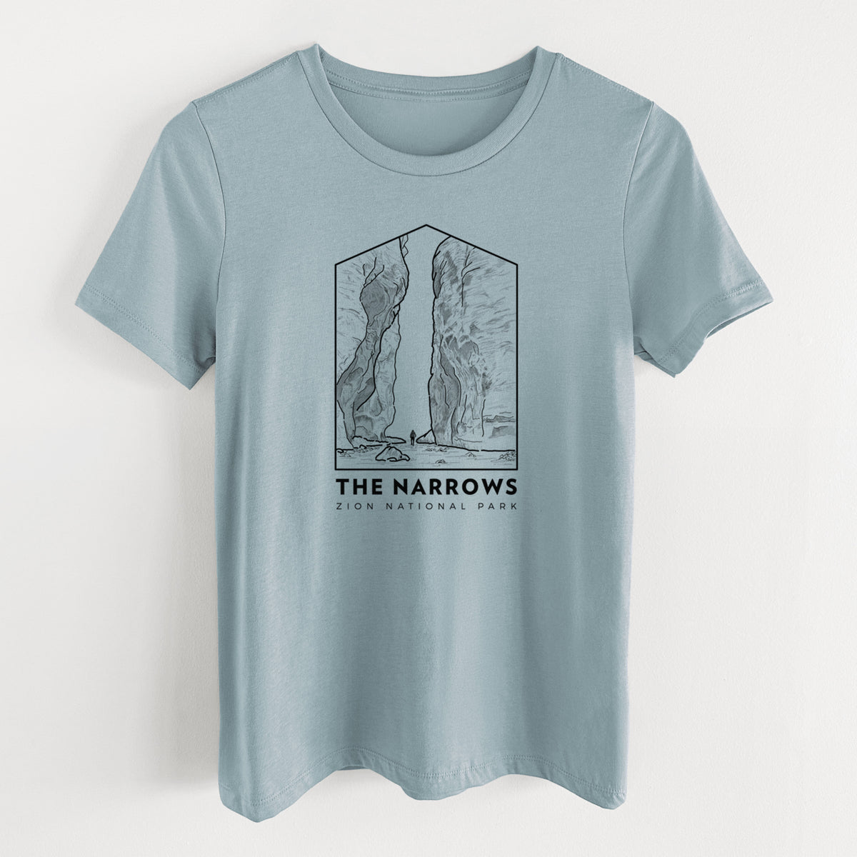 Vintage denim women's relaxed fit cotton t-shirt laid flat, printed with a black line art badge of the tall canyon walls of The Narrows, with the words The Narrows.