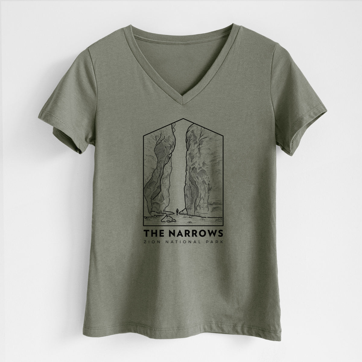 Military green women's relaxed fit cotton V-neck t-shirt laid flat, printed with a black line art badge of the tall canyon walls of The Narrows, with the words The Narrows.