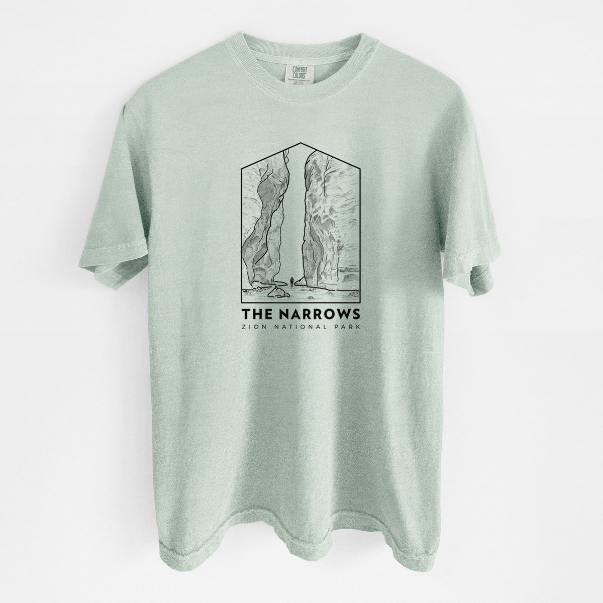 Bay green Comfort Colors t-shirt laid flat, printed with a black line art badge of the tall canyon walls of The Narrows, with the words The Narrows.