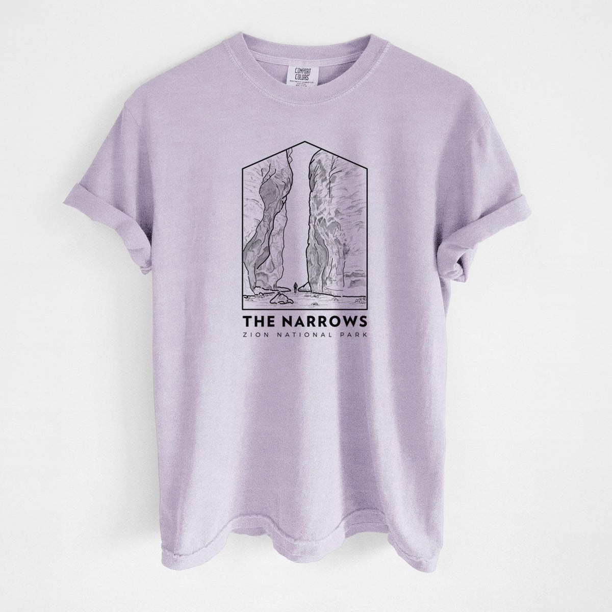 Orchid purple Comfort Colors t-shirt laid flat, printed with a black line art badge of the tall canyon walls of The Narrows, with the words The Narrows.