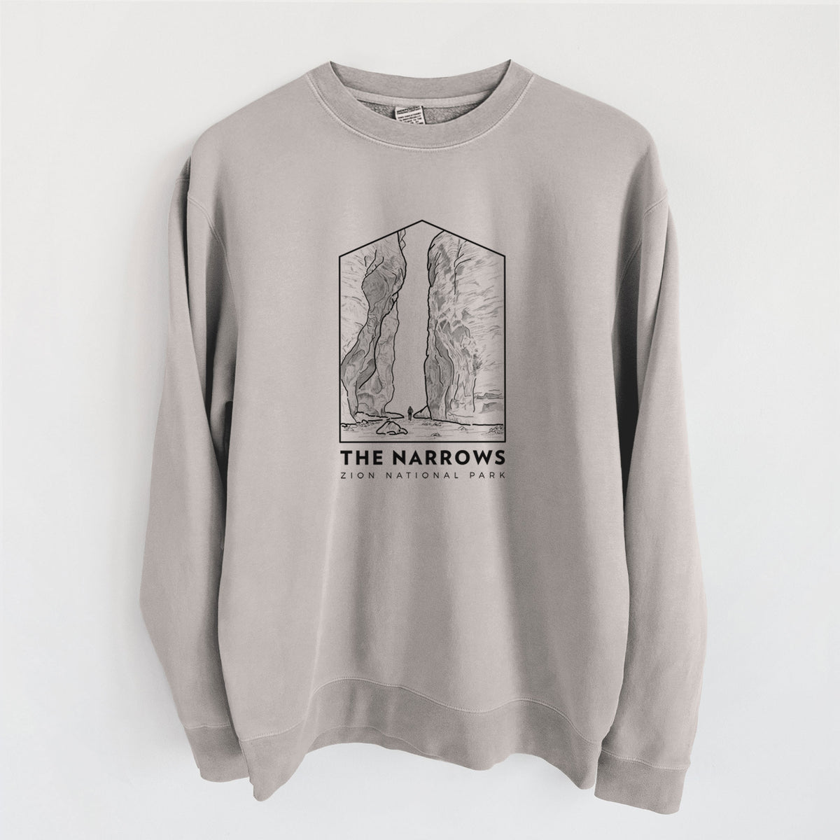 Cement grey pigment dyed crewneck sweatshirt laid flat, printed with a black line art badge of the tall canyon walls of The Narrows, with the words The Narrows.