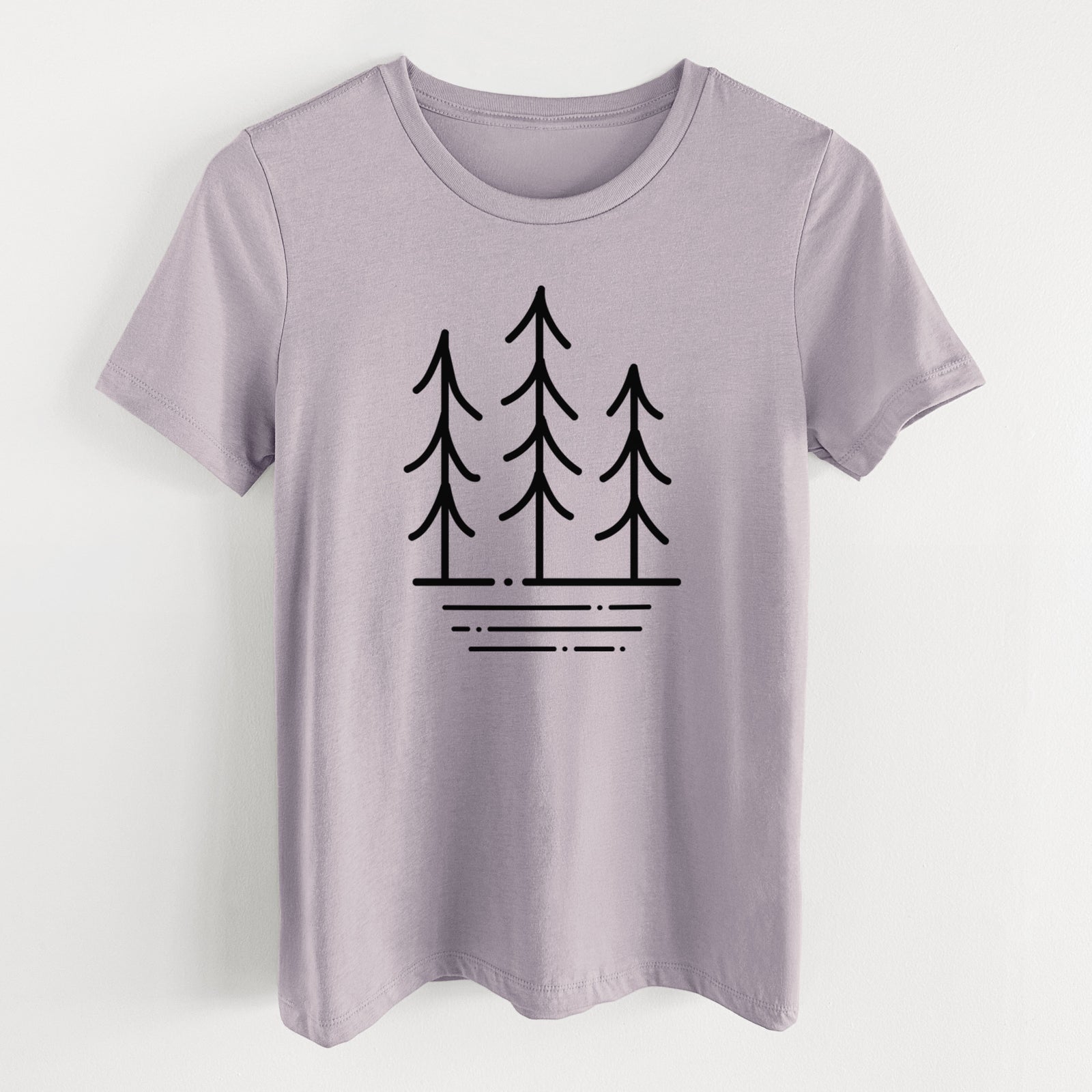 Light violet women's relaxed fit cotton t-shirt laid flat, printed with black line art of three simple pine trees above horizontal lines.