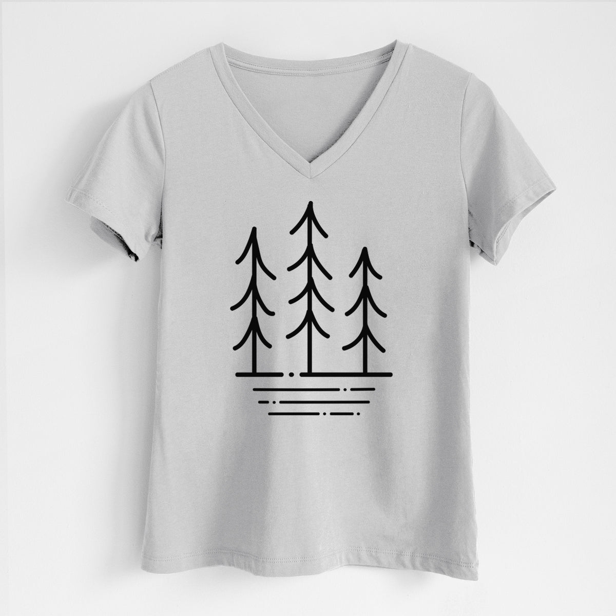 Lunar grey women's relaxed fit cotton V-neck t-shirt laid flat, printed with black line art of three simple pine trees above horizontal lines.