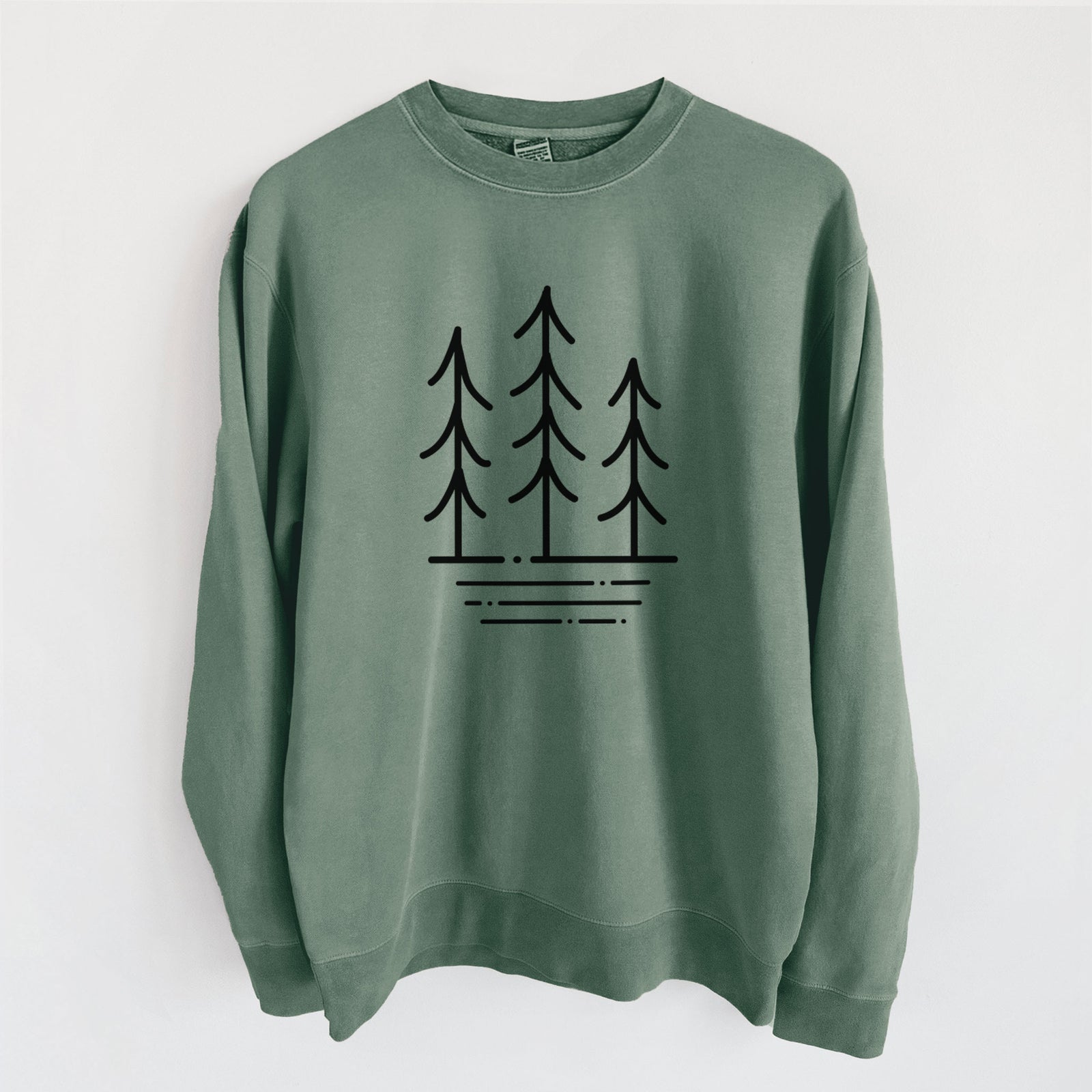 Alpine green pigment dyed crewneck sweatshirt laid flat, printed with black line art of three simple pine trees above horizontal lines.