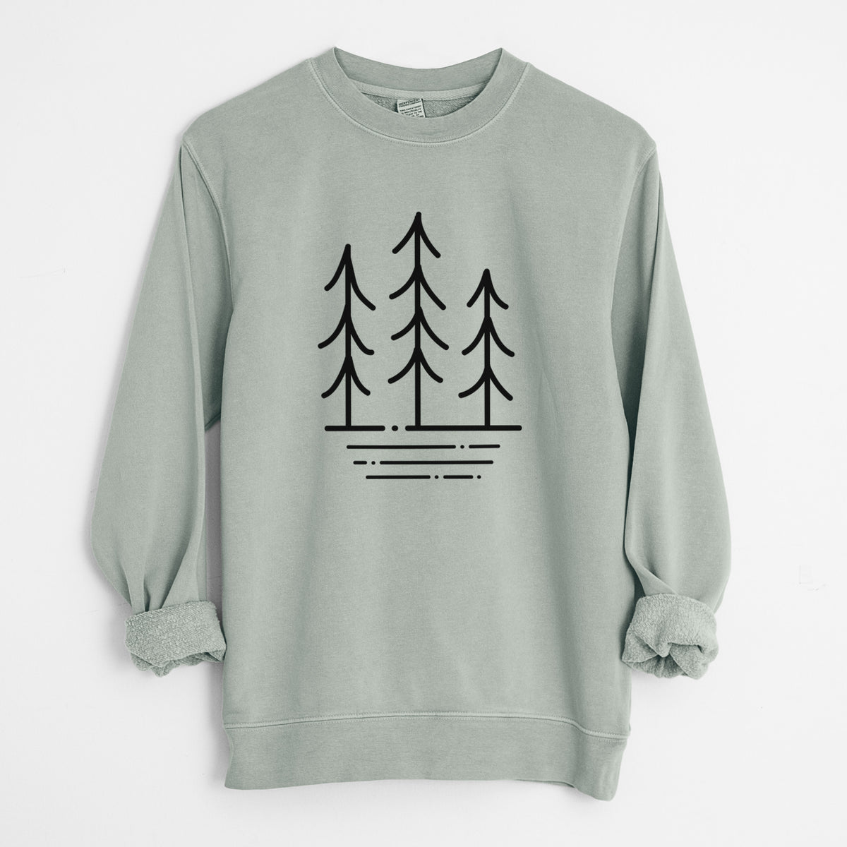 Sage green pigment dyed crewneck sweatshirt laid flat with the sleeves rolled, printed with black line art of three simple pine trees above horizontal lines.