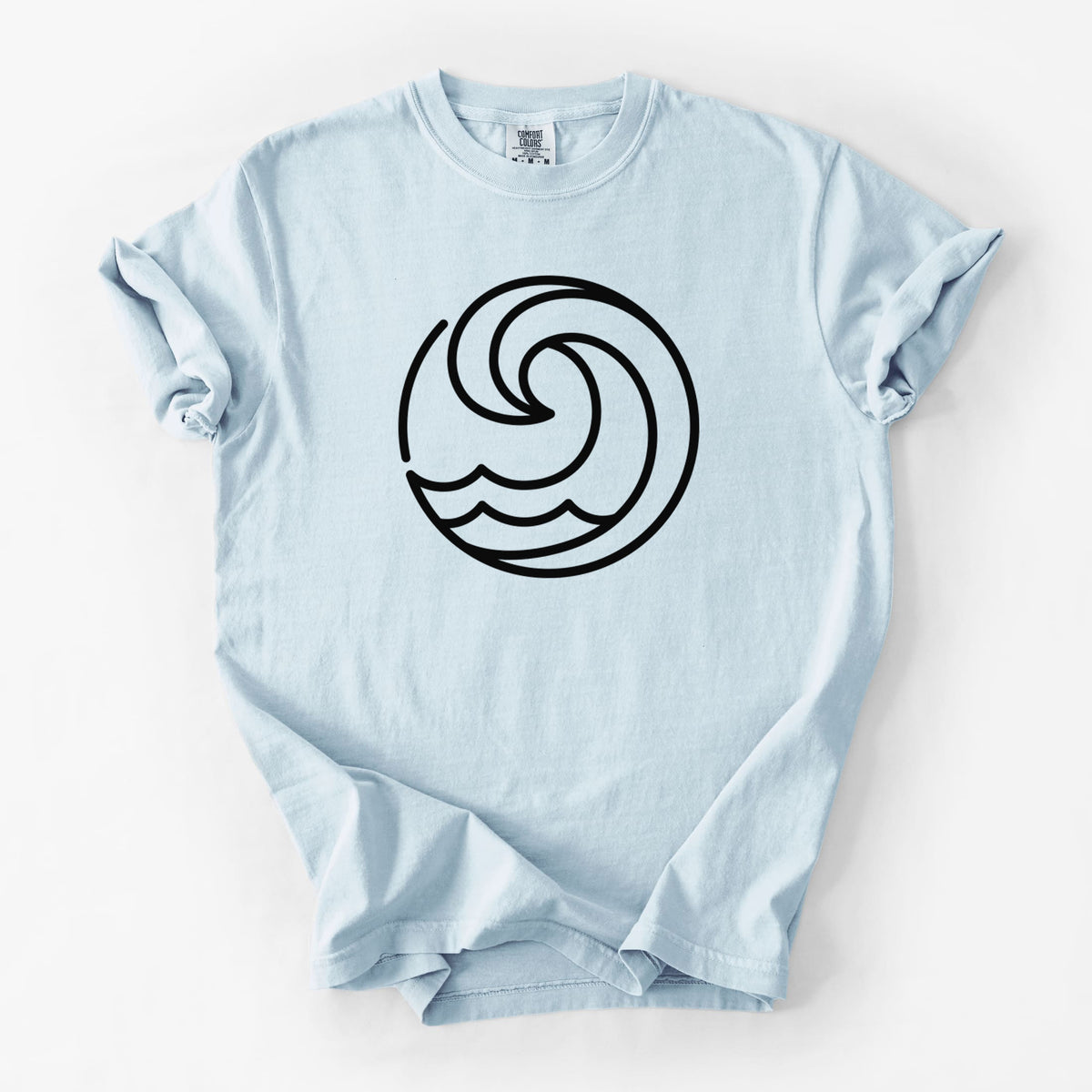 Chambray blue Comfort Colors t-shirt laid flat, printed with a bold black line art circle of a curling ocean wave.