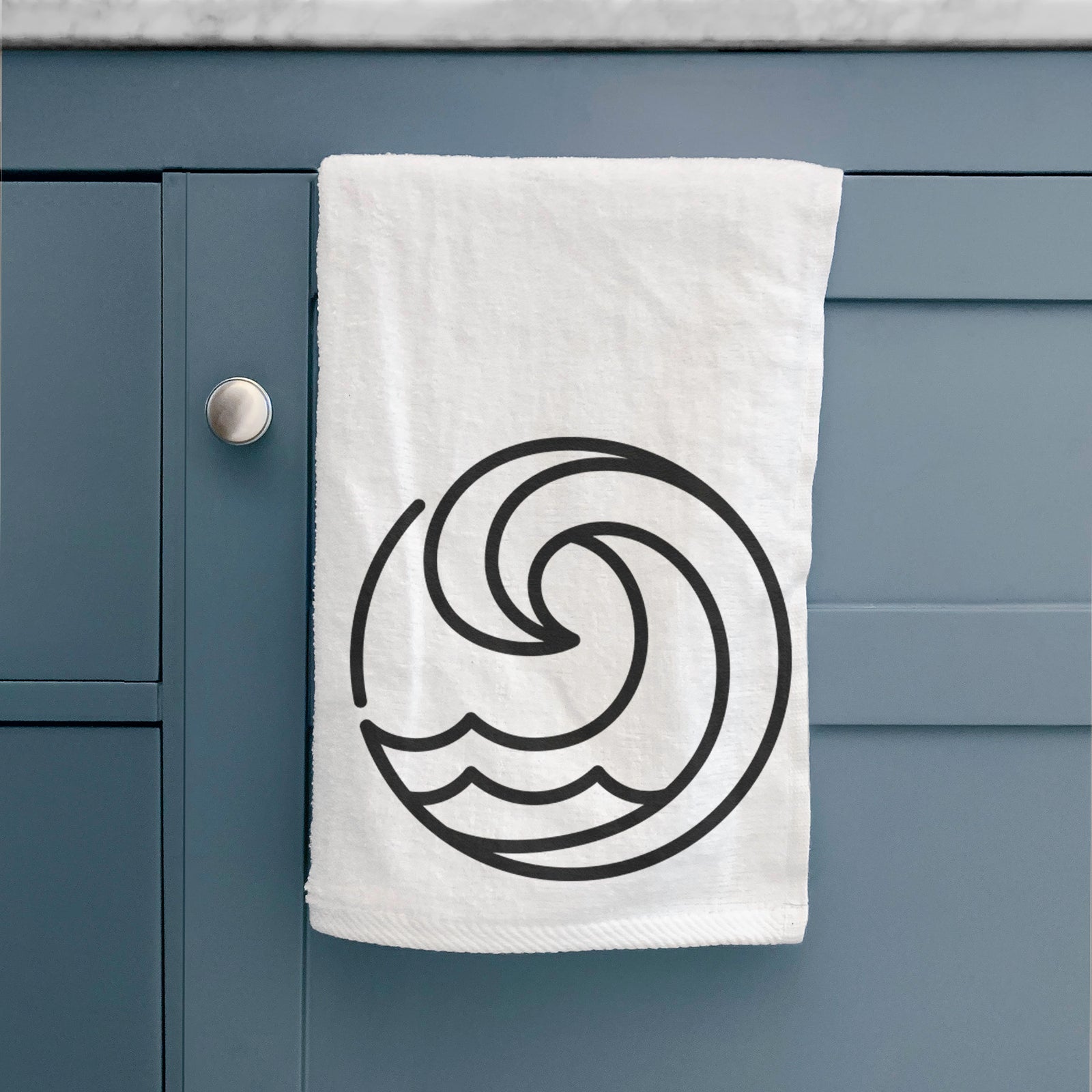 White hand towel printed with a bold black line art circle of a curling ocean wave.