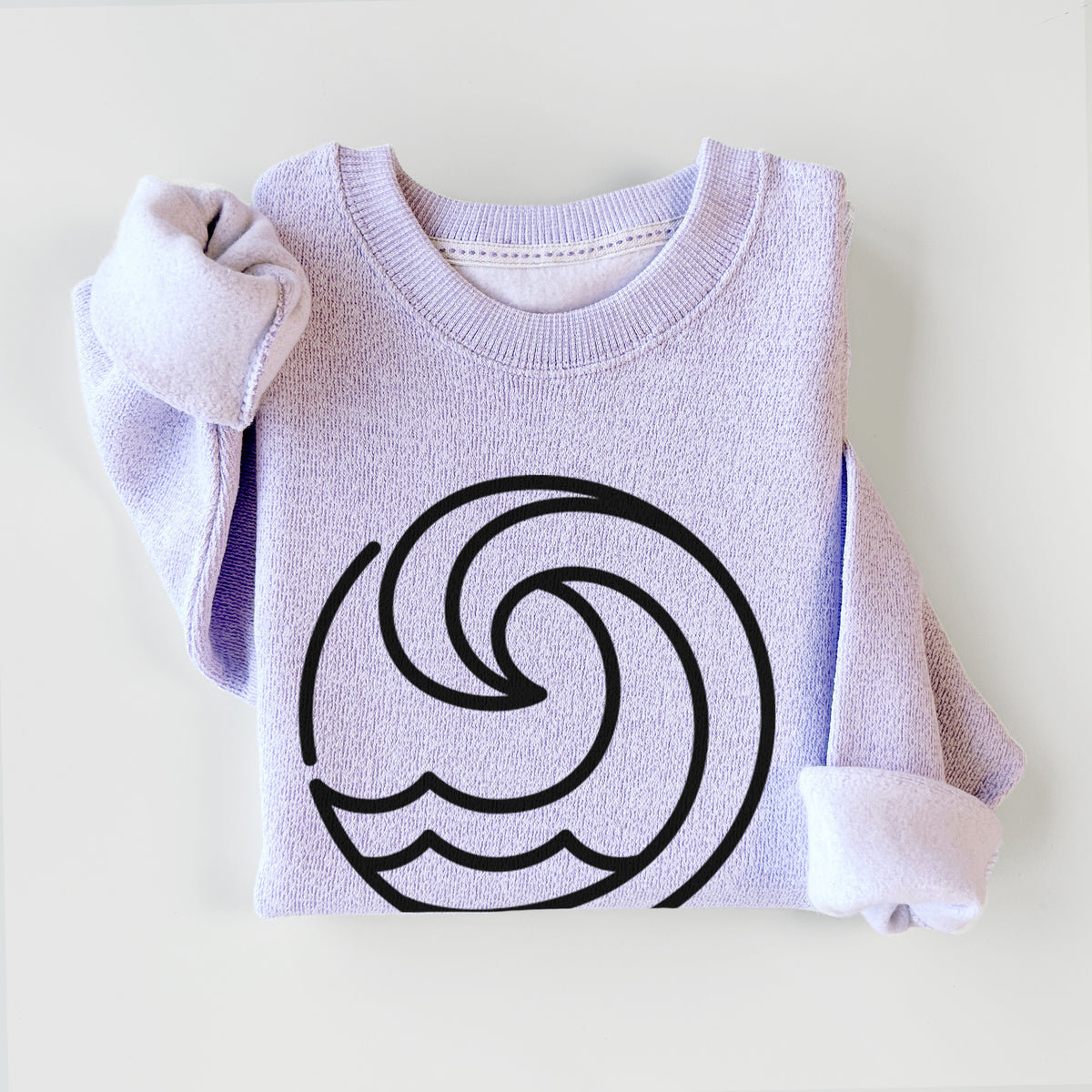 Ice purple knit sweatshirt printed with a bold black line art circle of a curling ocean wave, styled flat.