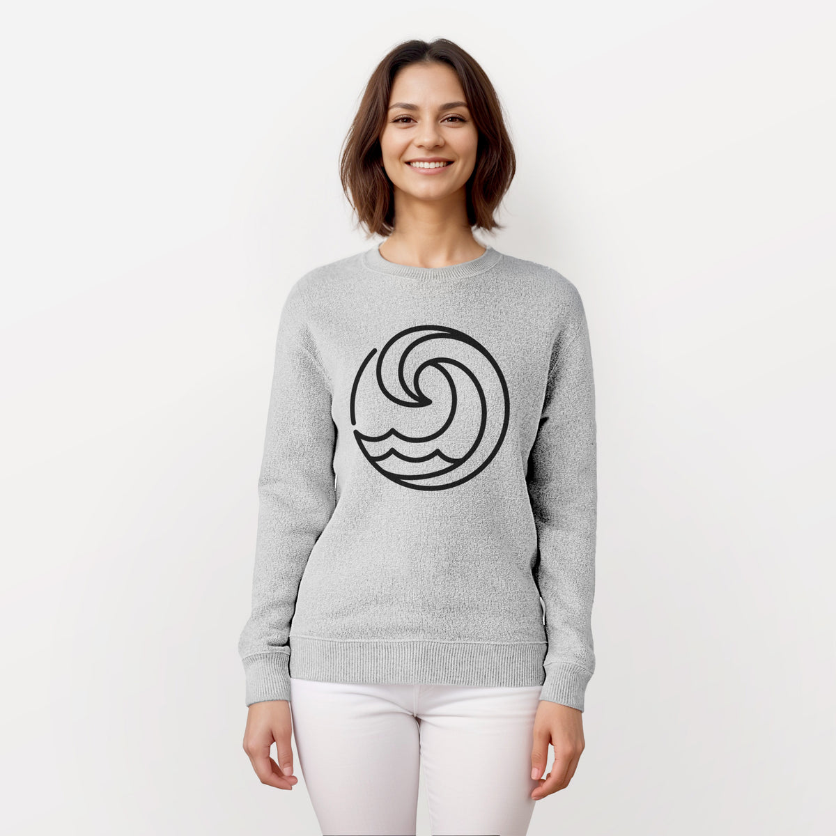 Woman wearing a knit sweatshirt printed with a bold black line art circle of a curling ocean wave.