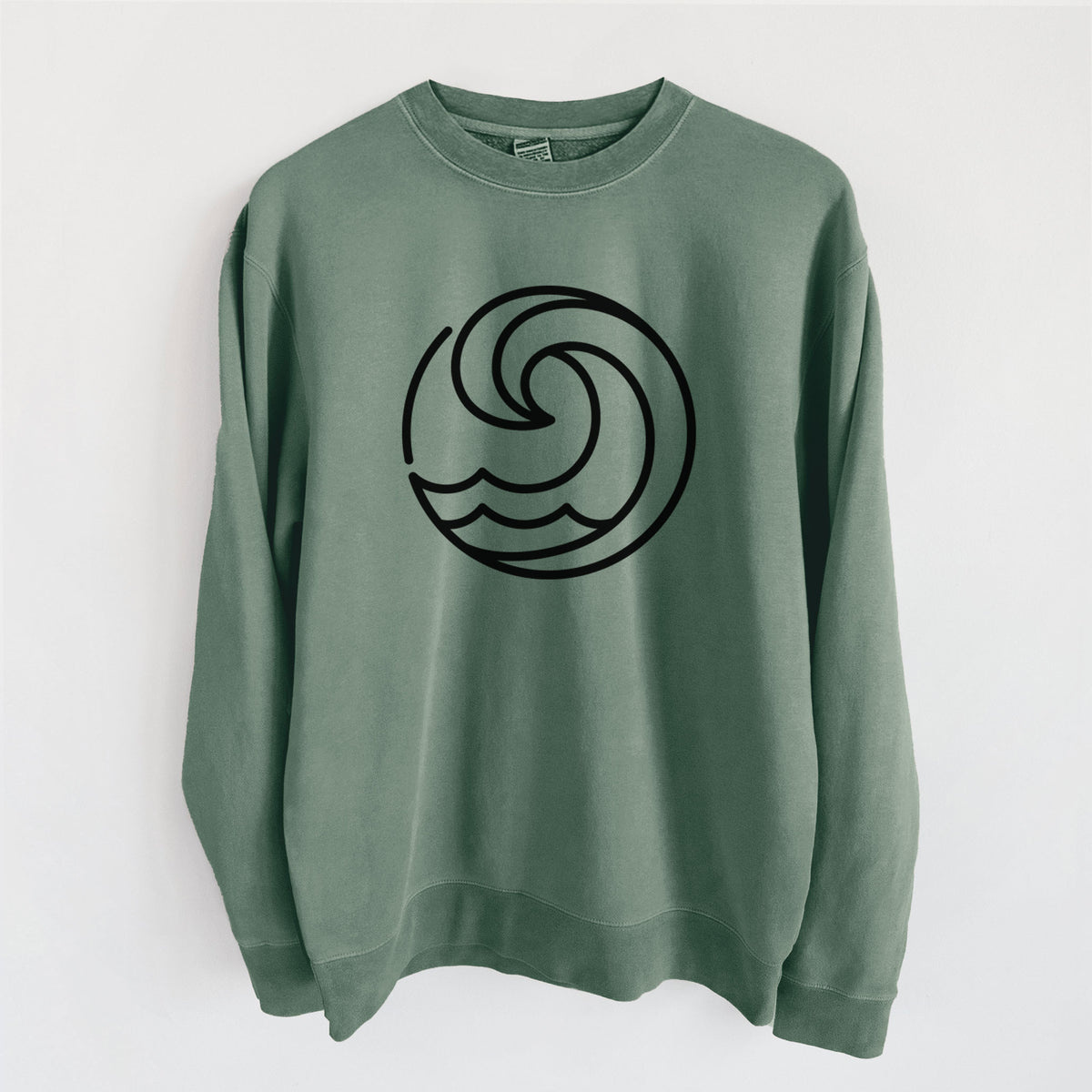 Alpine green pigment dyed crewneck sweatshirt laid flat, printed with a bold black line art circle of a curling ocean wave.