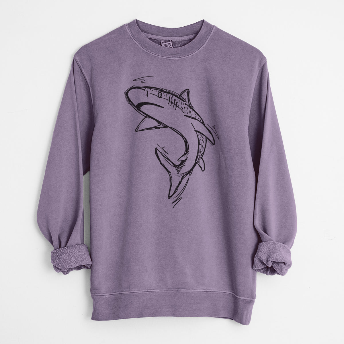 Plum purple pigment dyed crewneck sweatshirt laid flat with the sleeves rolled, printed with a black ink illustration of a tiger shark swimming in a curve.