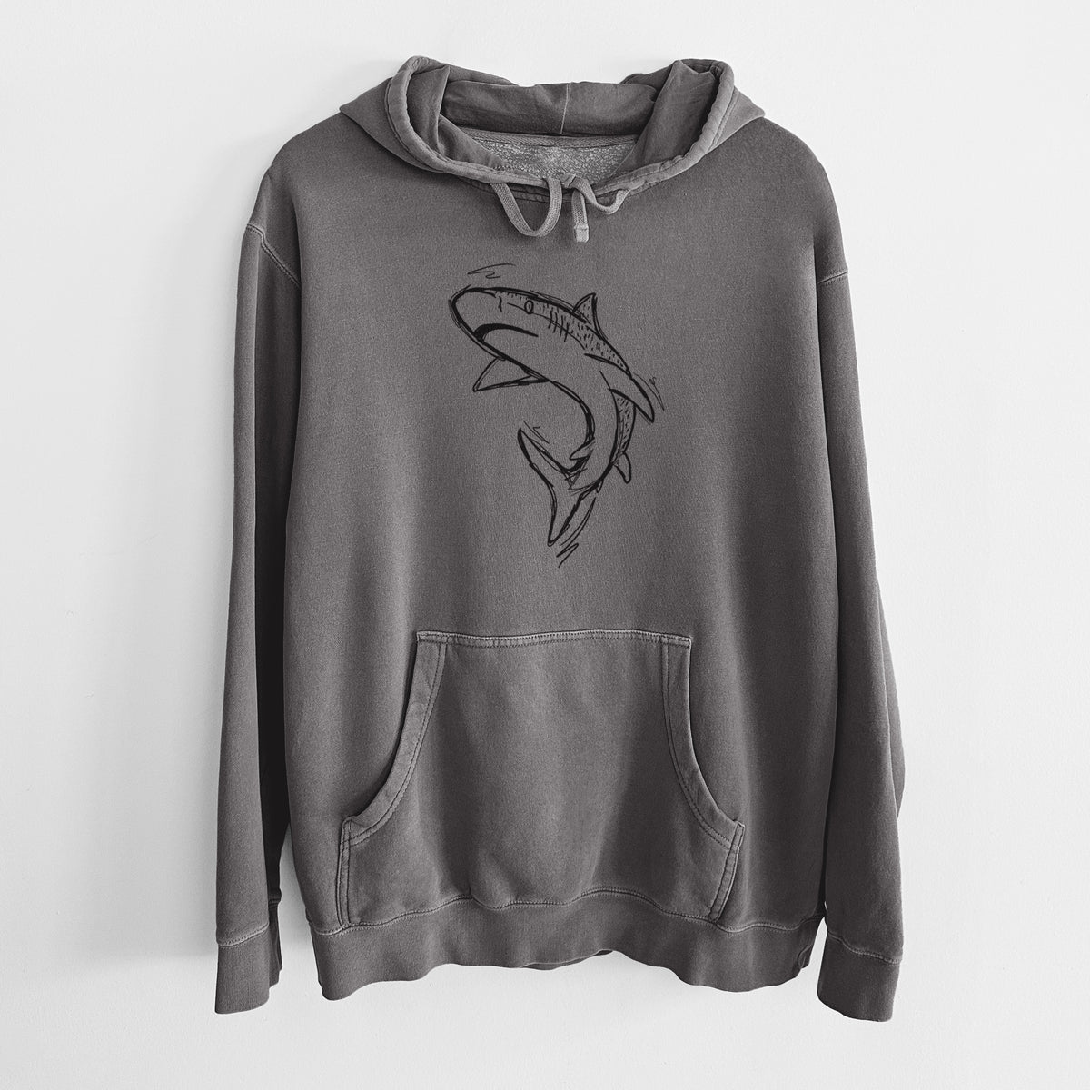 Faded black pigment dyed hoodie laid flat, printed with a black ink illustration of a tiger shark swimming in a curve.