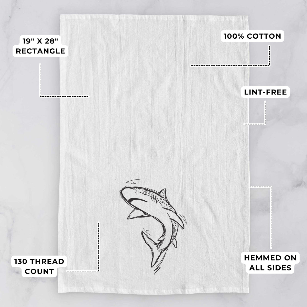 White tea towel printed with a black ink illustration of a tiger shark swimming in a curve, with feature labels: 19 by 28 inch rectangle, 100% cotton, lint-free, 130 thread count, hemmed on all sides.
