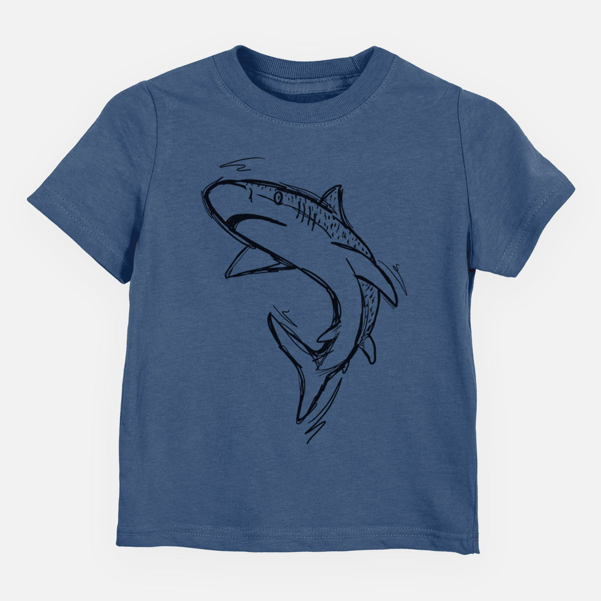Indigo blue toddler t-shirt laid flat, printed with a black ink illustration of a tiger shark swimming in a curve.