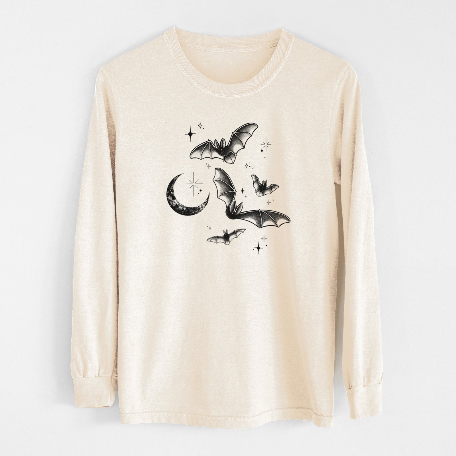 Ivory Comfort Colors long sleeve shirt laid flat, printed with black ink Townsend's big-eared bats flying around a crescent moon and stars.