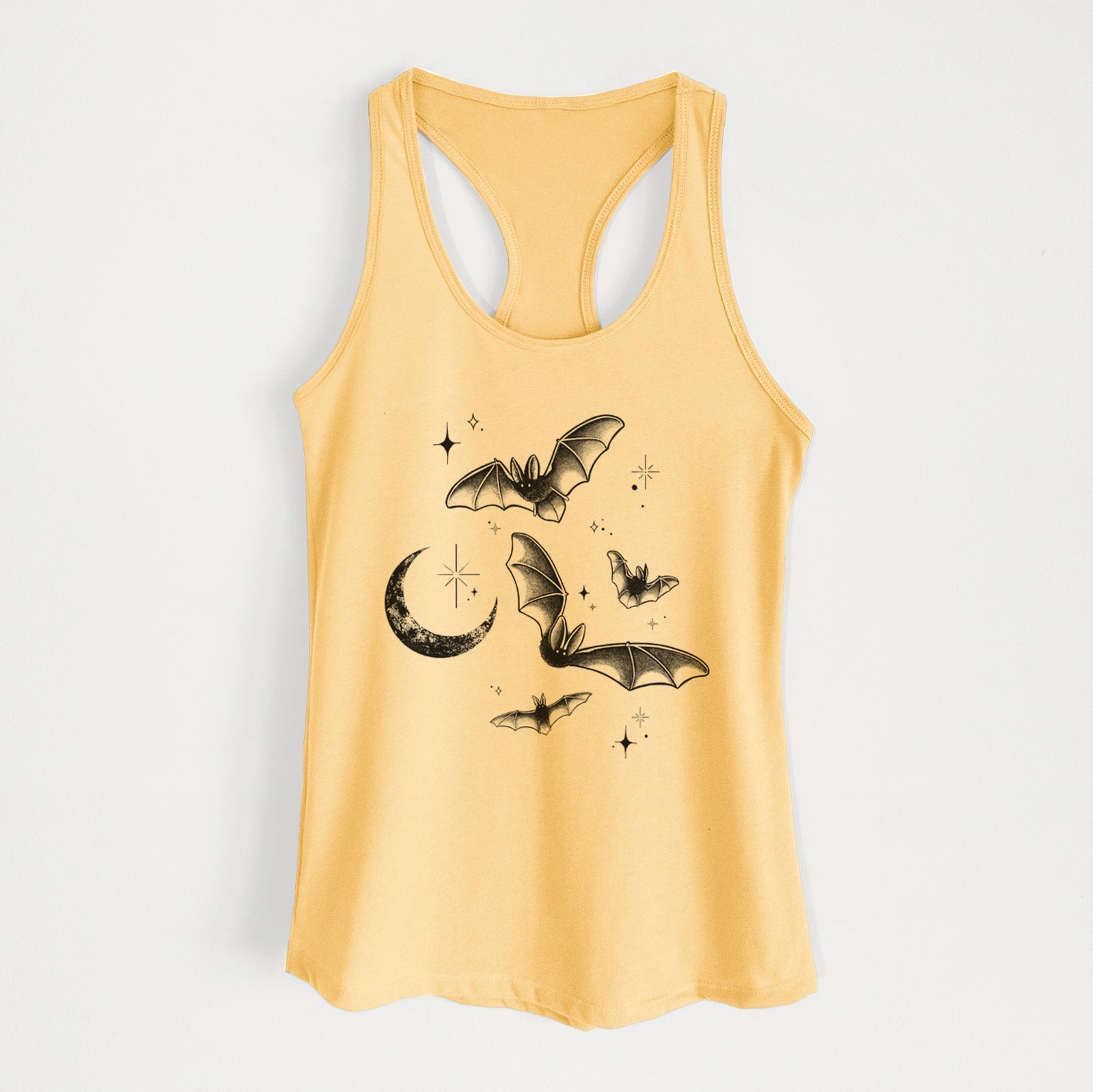 Banana cream women's racerback tank top laid flat, printed with black ink Townsend's big-eared bats flying around a crescent moon and stars.