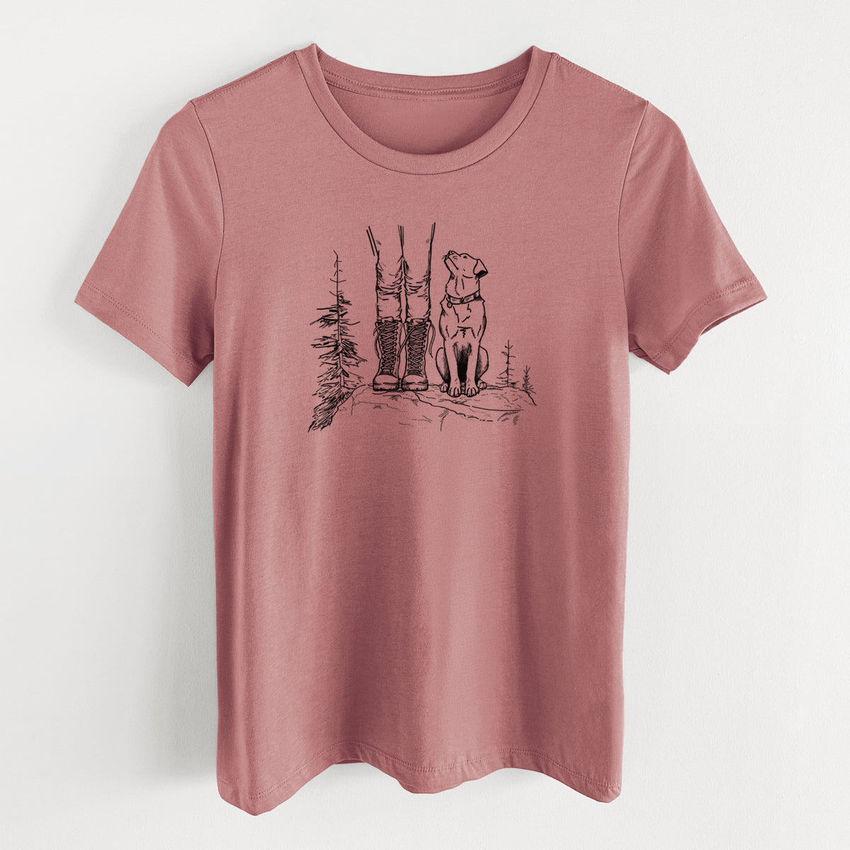 Mauve pink women's relaxed fit cotton t-shirt laid flat, printed with a black ink illustration of a hiker in boots and a dog sitting side by side on a forest trail, seen from behind.