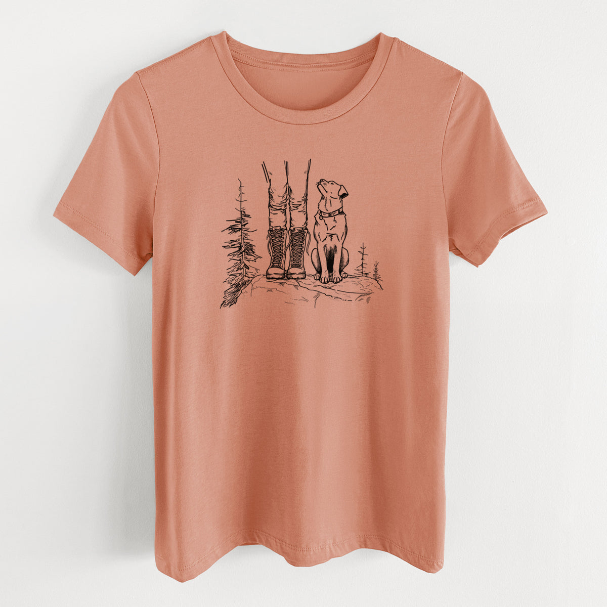 Terracotta orange women's relaxed fit cotton t-shirt laid flat, printed with a black ink illustration of a hiker in boots and a dog sitting side by side on a forest trail, seen from behind.