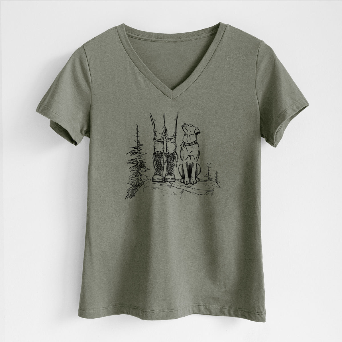 Military green women's relaxed fit cotton V-neck t-shirt laid flat, printed with a black ink illustration of a hiker in boots and a dog sitting side by side on a forest trail, seen from behind.