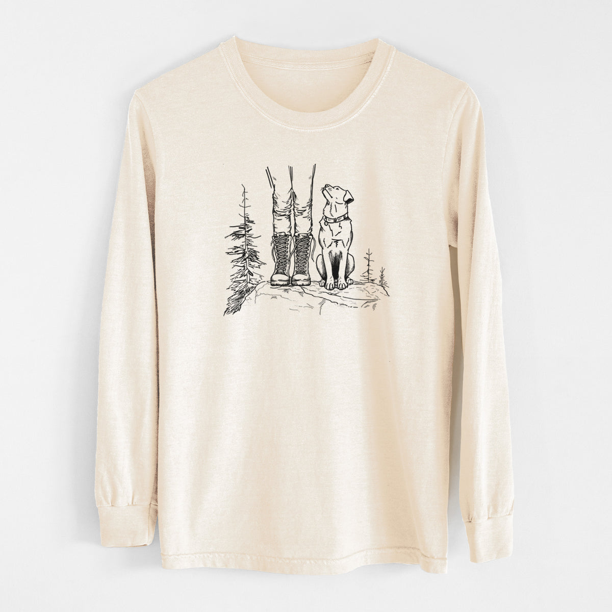 Ivory Comfort Colors long sleeve shirt laid flat, printed with a black ink illustration of a hiker in boots and a dog sitting side by side on a forest trail, seen from behind.
