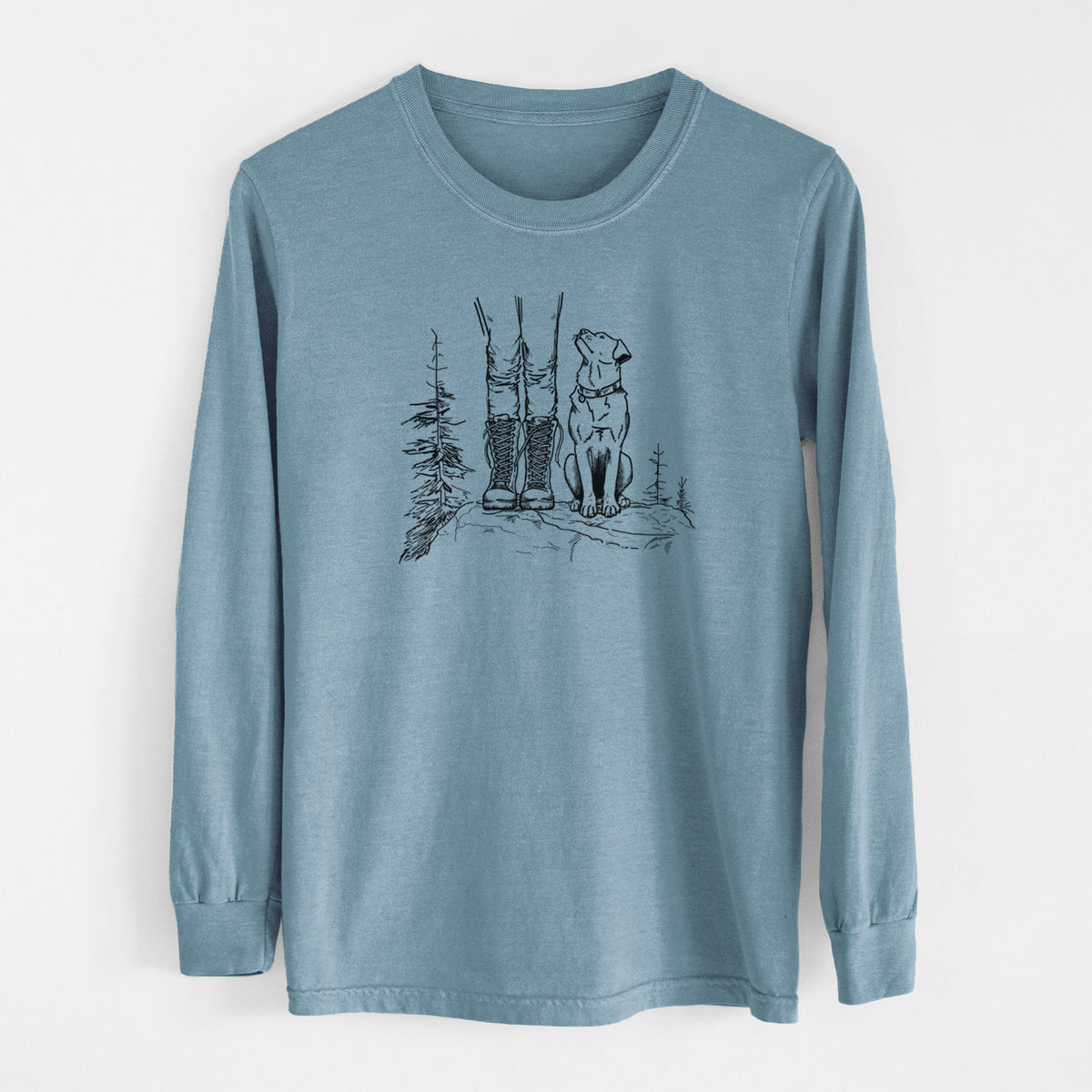 Steel blue Comfort Colors long sleeve shirt laid flat, printed with a black ink illustration of a hiker in boots and a dog sitting side by side on a forest trail, seen from behind.