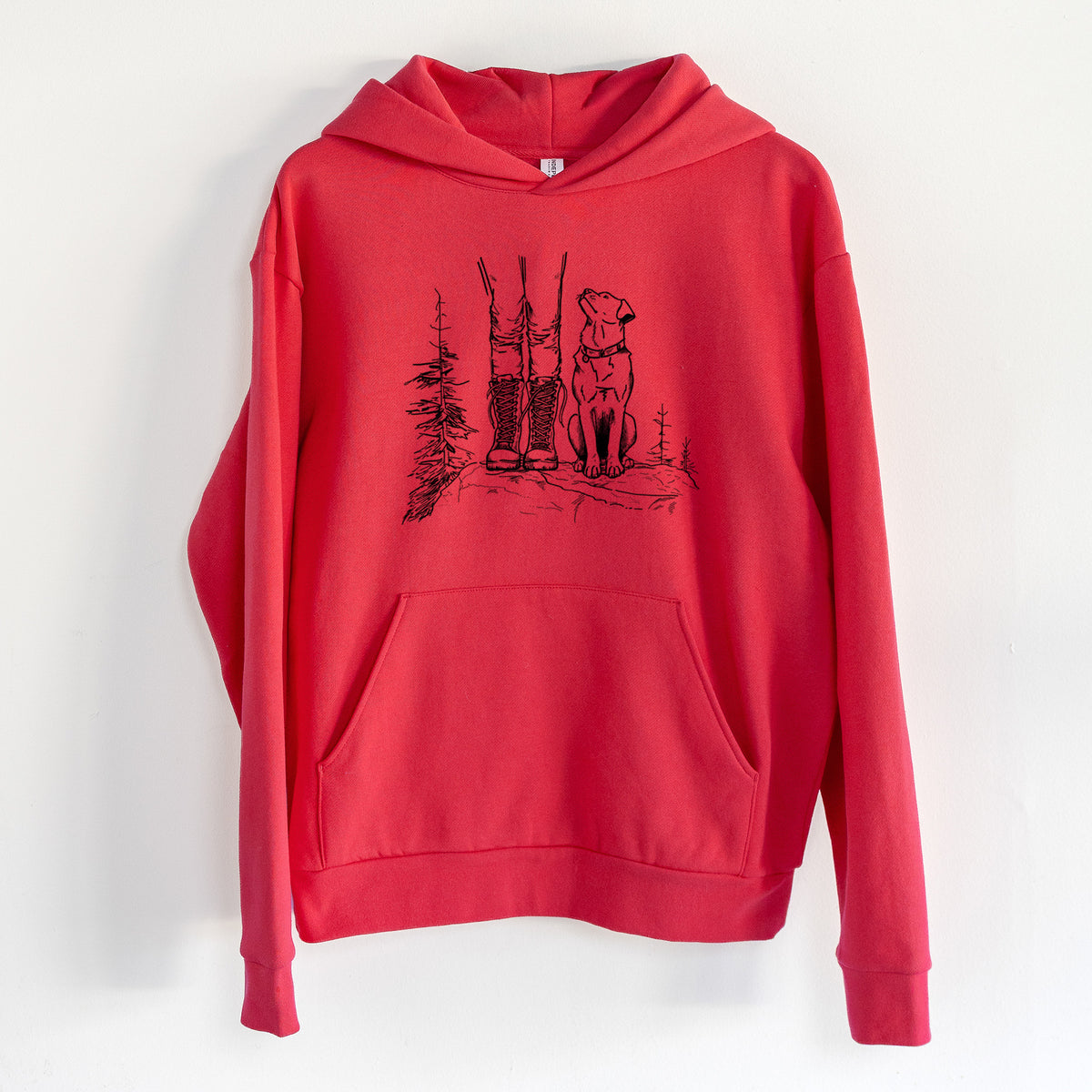 Trail Companions - Hiking with Dogs - Statement Midweight Hoodie in Cherry Red, hanging on a white wall, with a front kangaroo pocket and no drawcords.
