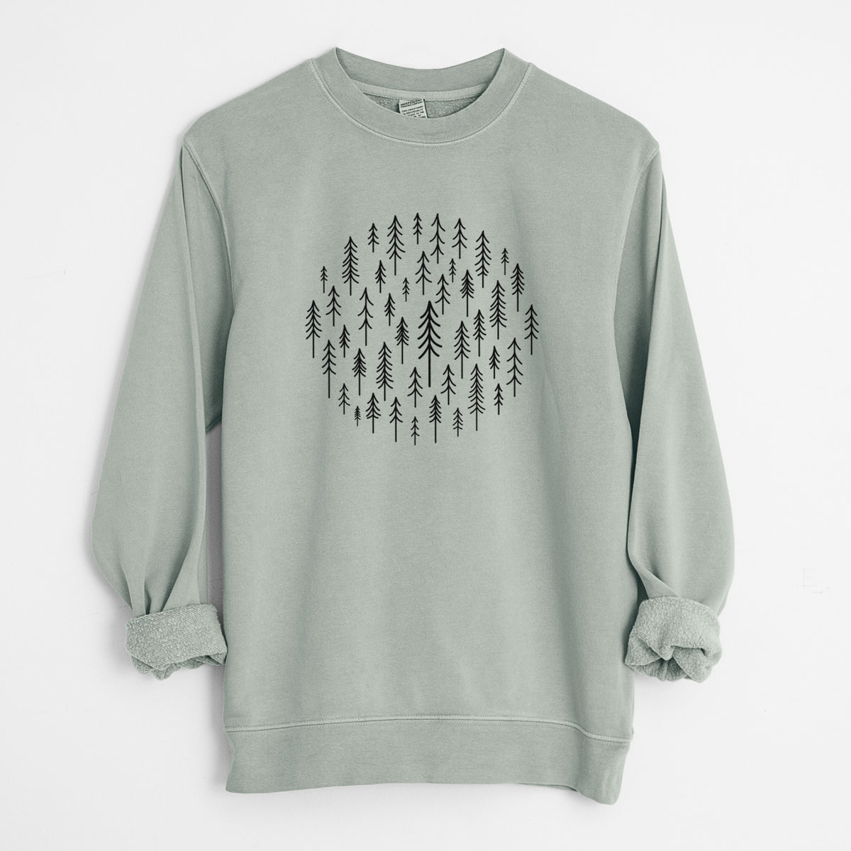 Sage green pigment dyed crewneck sweatshirt laid flat with the sleeves rolled, printed with a circle made of small black ink pine trees.