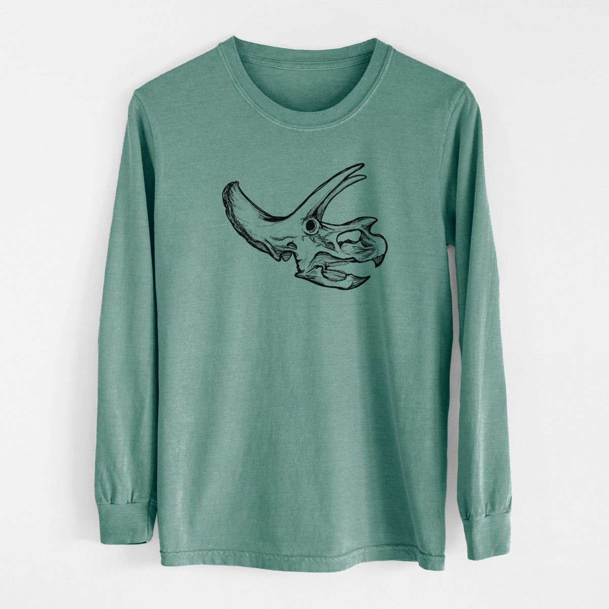 Pine green Comfort Colors long sleeve shirt laid flat, printed with a detailed black ink illustration of a Triceratops skull with its horns and frill.