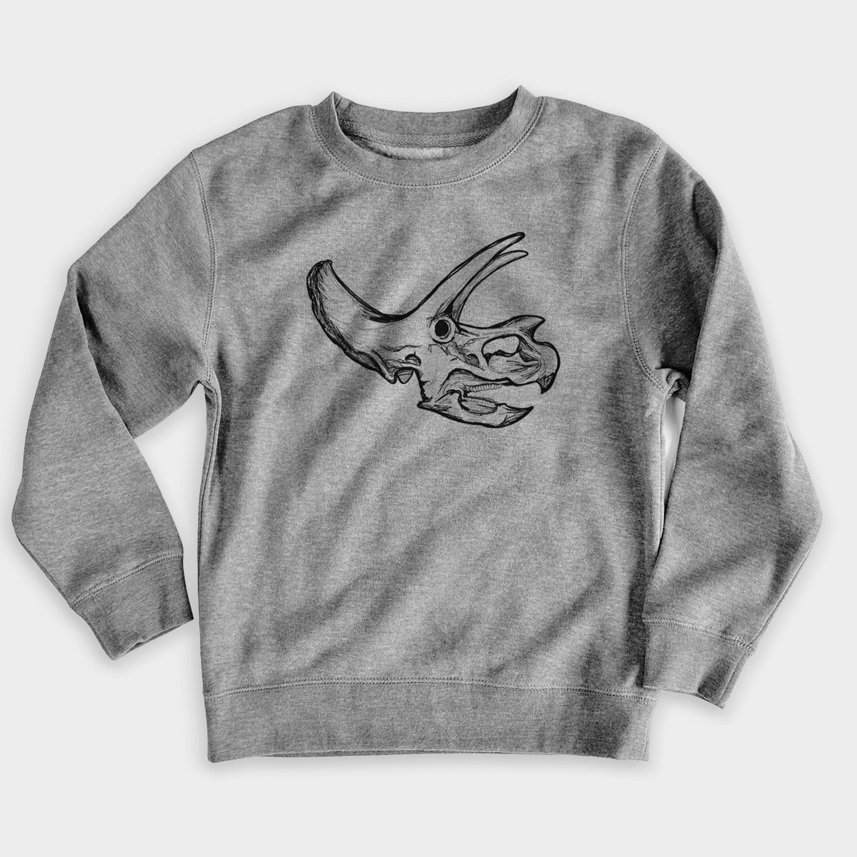 Nickel grey youth crewneck sweatshirt laid flat, printed with a detailed black ink illustration of a Triceratops skull with its horns and frill.