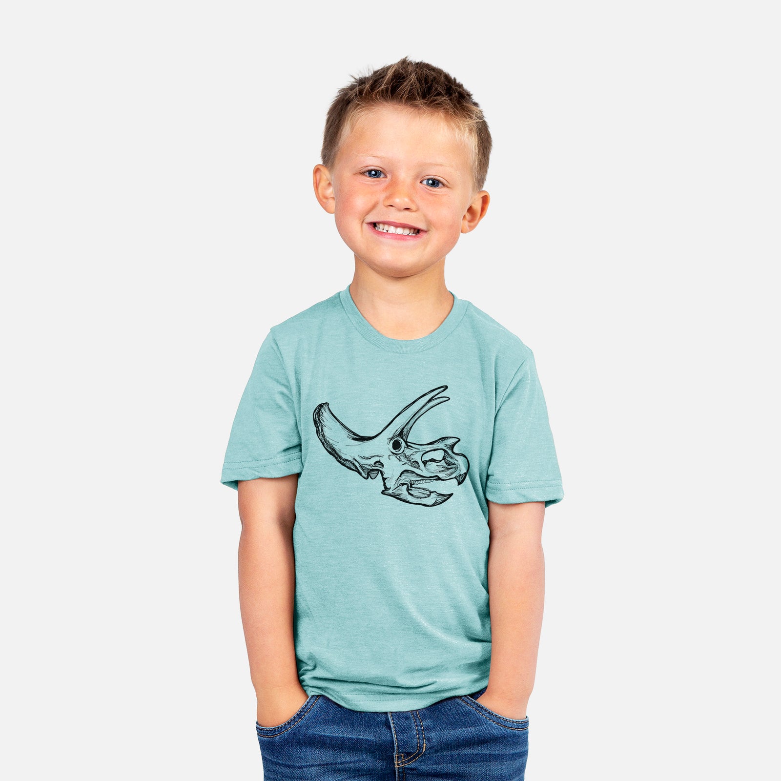 Two youth t-shirts in different colors on hangers, printed with a detailed black ink illustration of a Triceratops skull with its horns and frill.